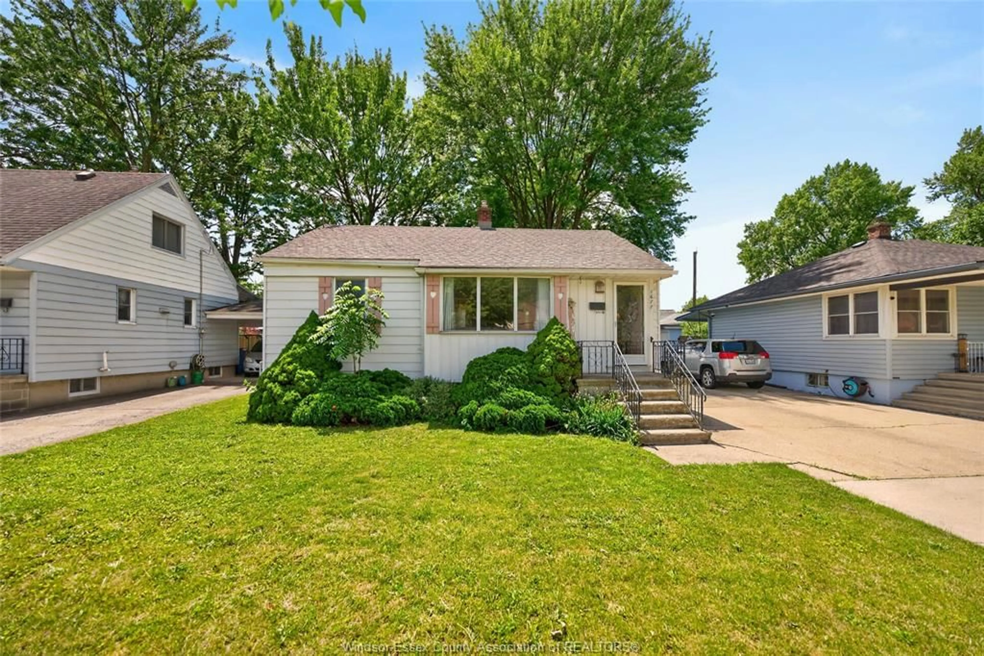 Home with vinyl exterior material, street for 1677 Norman Rd, Windsor Ontario N8Y 4N6