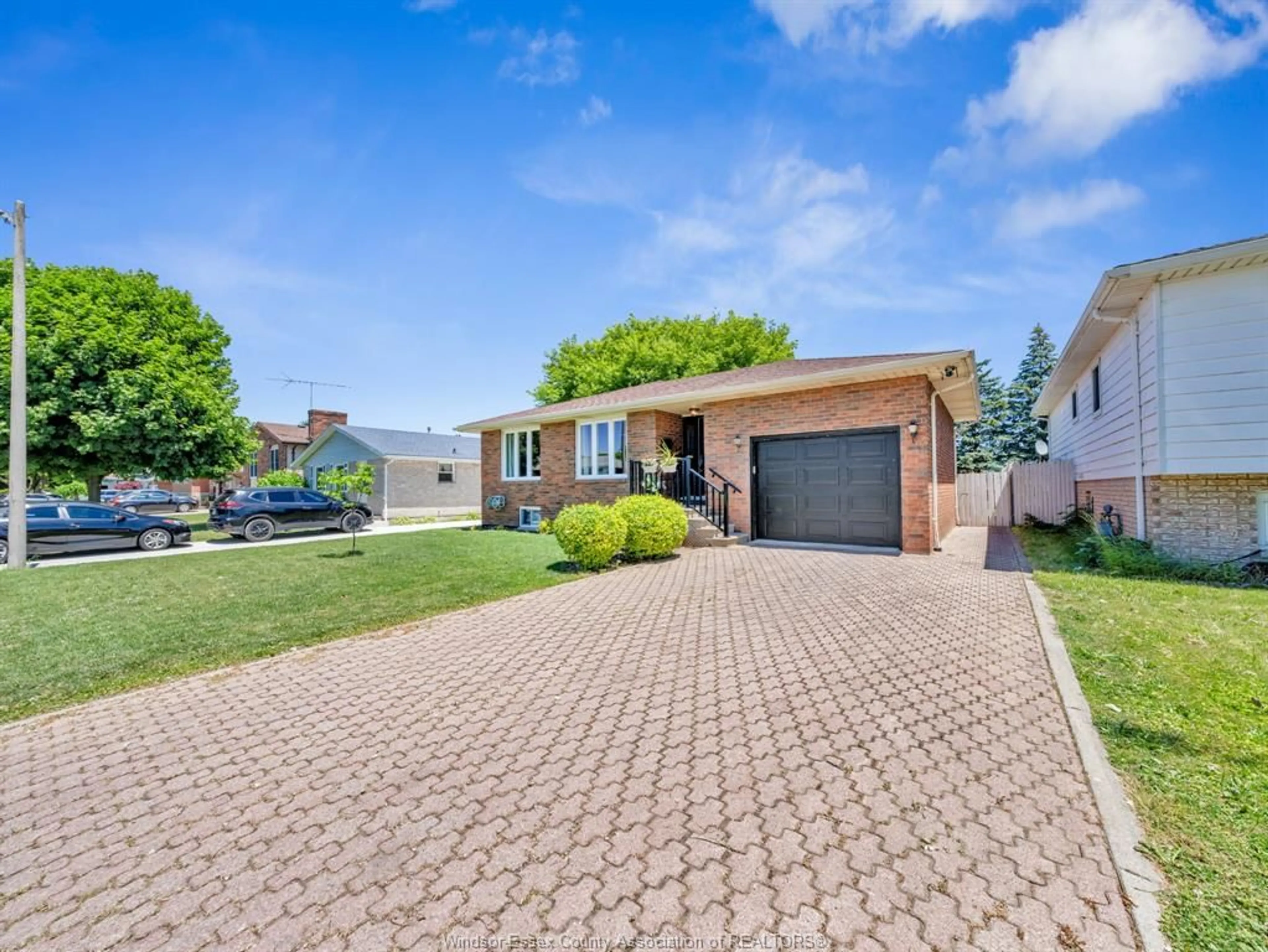 Home with brick exterior material, street for 24 CAMELOT, Leamington Ontario N8H 4V6