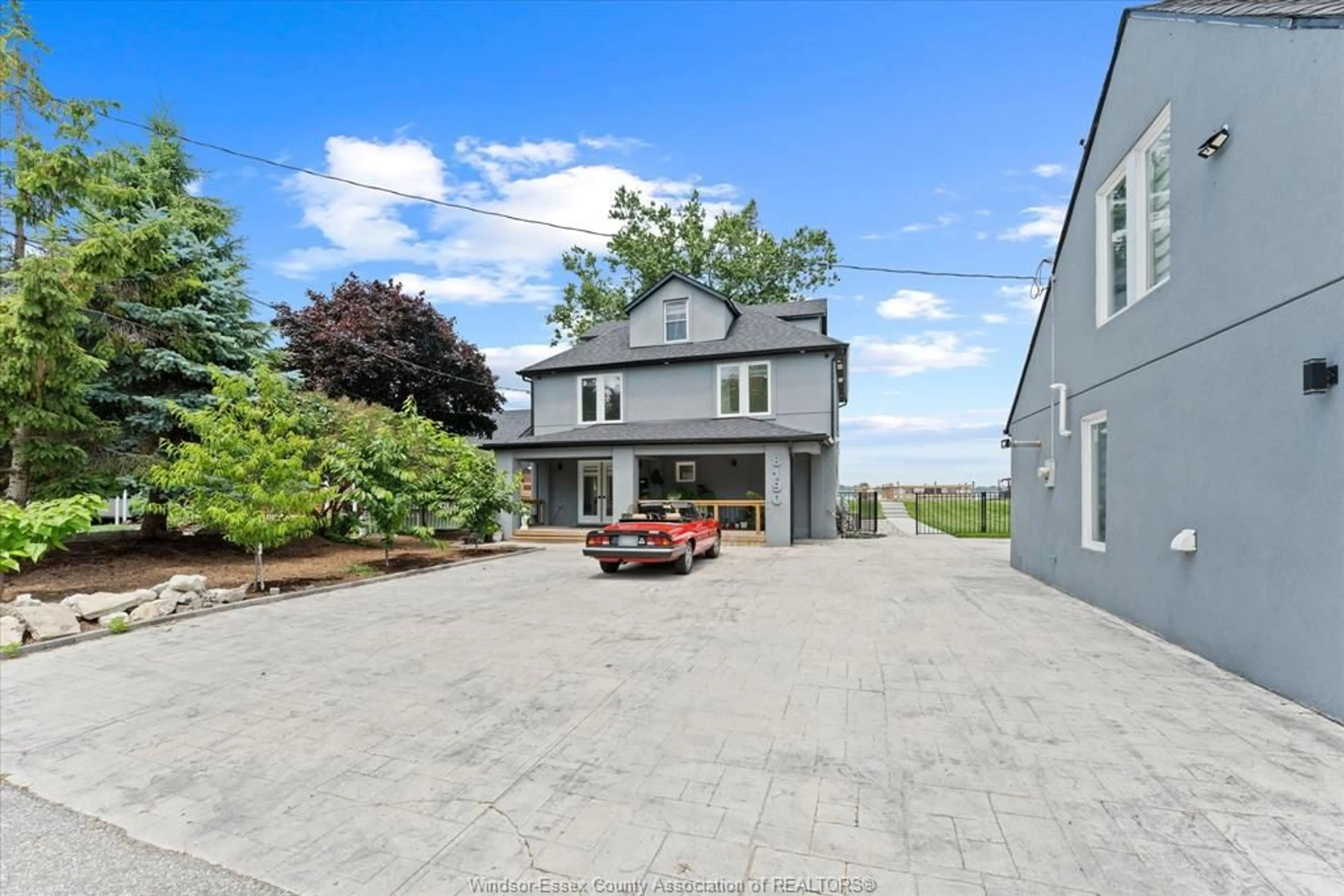 A pic from outside/outdoor area/front of a property/back of a property/a pic from drone, street for 8190 RIVERSIDE Dr, Windsor Ontario N8S 1E4
