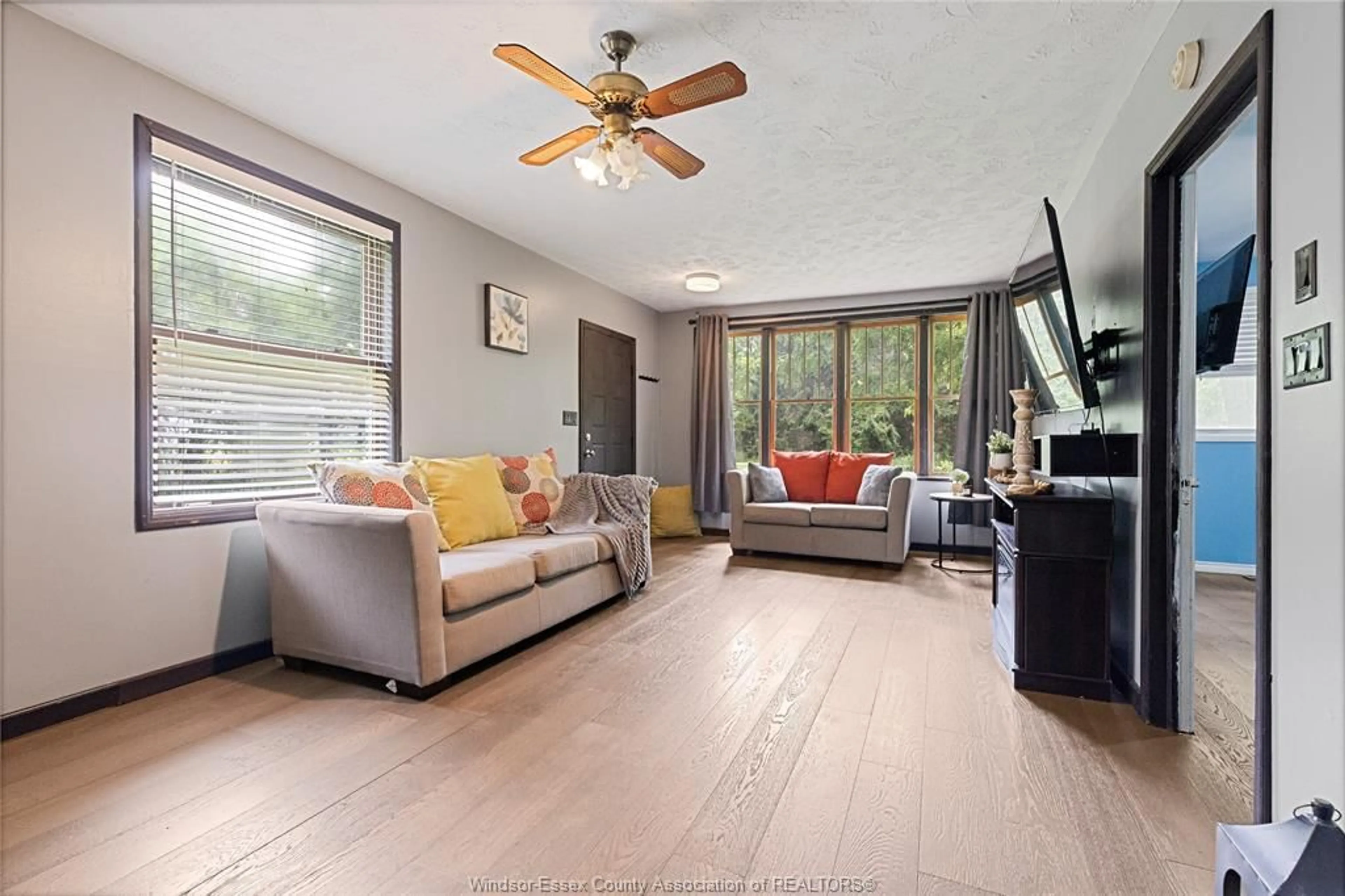 Living room with furniture, wood/laminate floor for 19781 DILLION Rd, Chatham Ontario N0P 1A0