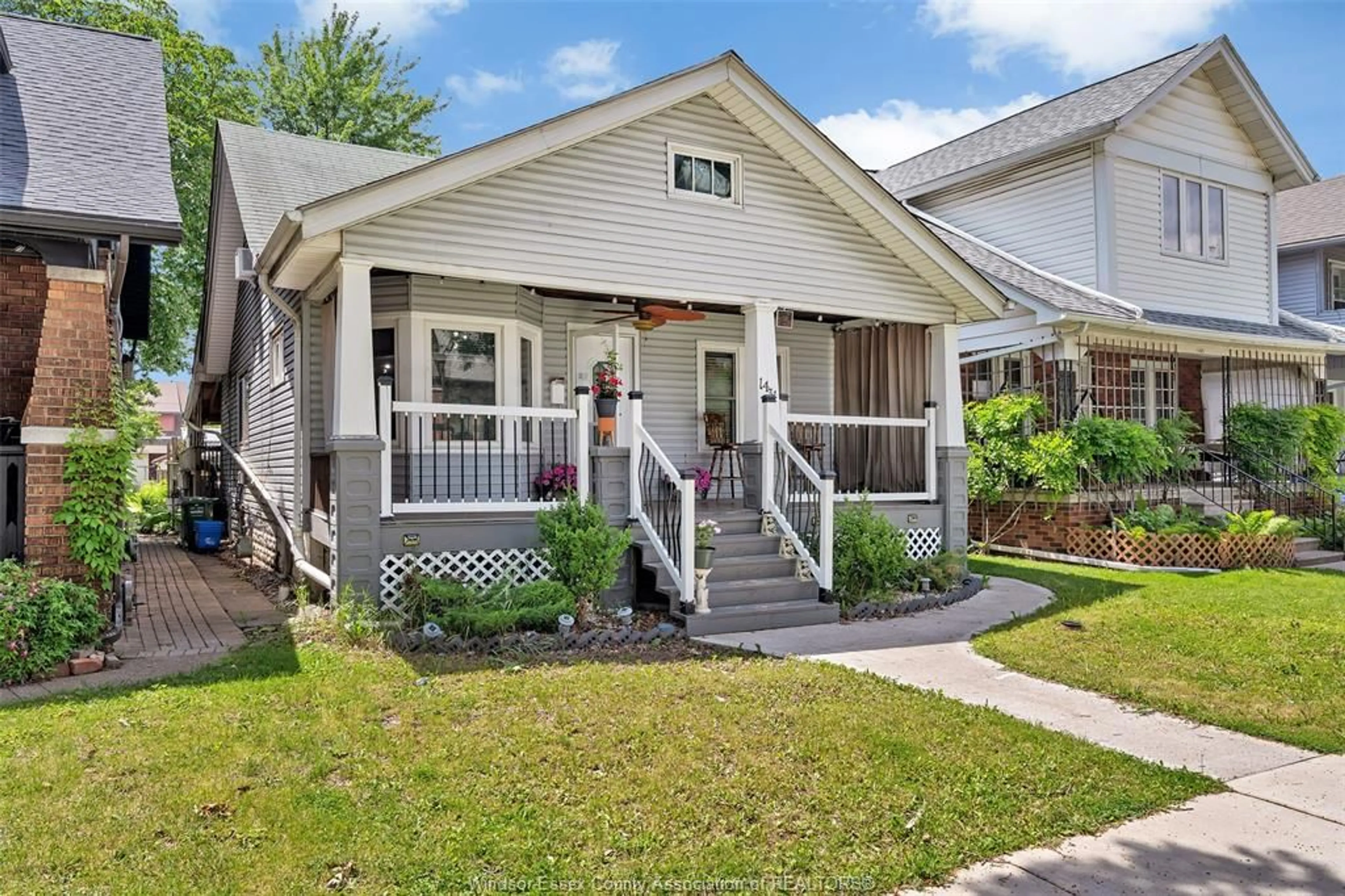 Home with vinyl exterior material, street for 1431 Langlois, Windsor Ontario N8X 4L9