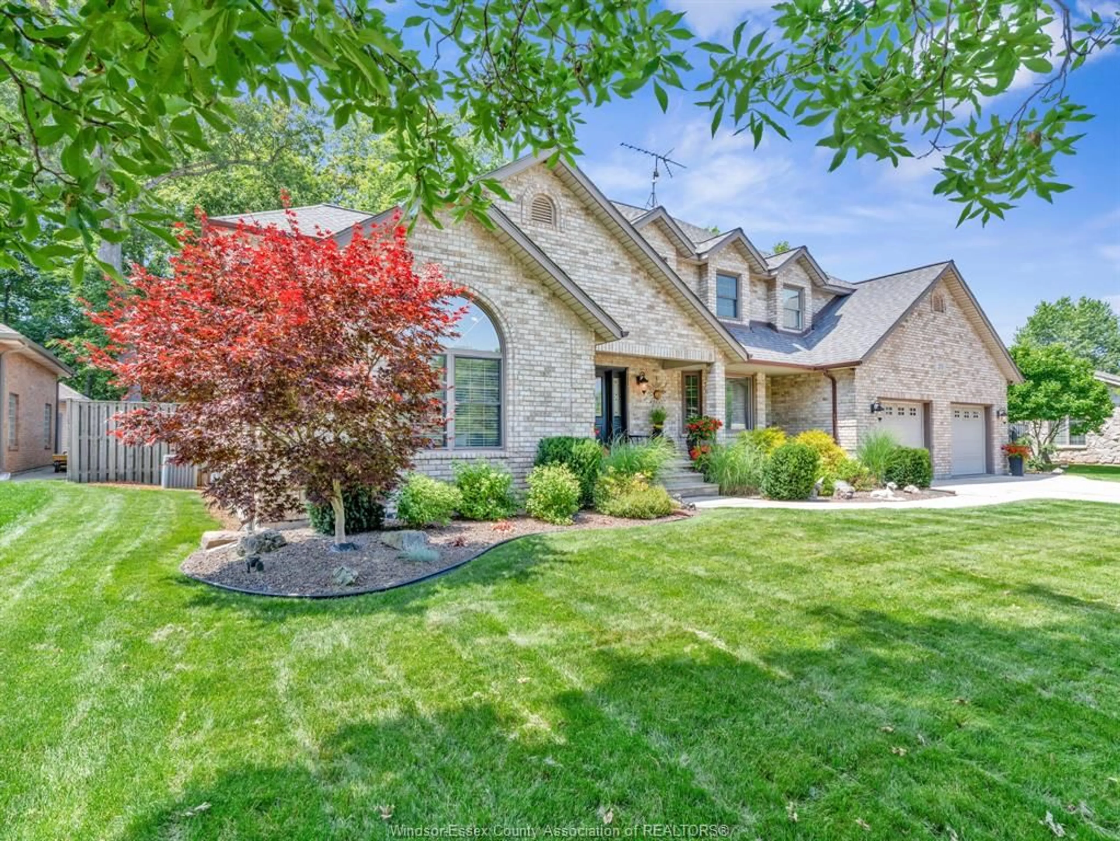 Home with brick exterior material, street for 205 WOODLAND Dr, Harrow Ontario N0R 1G0