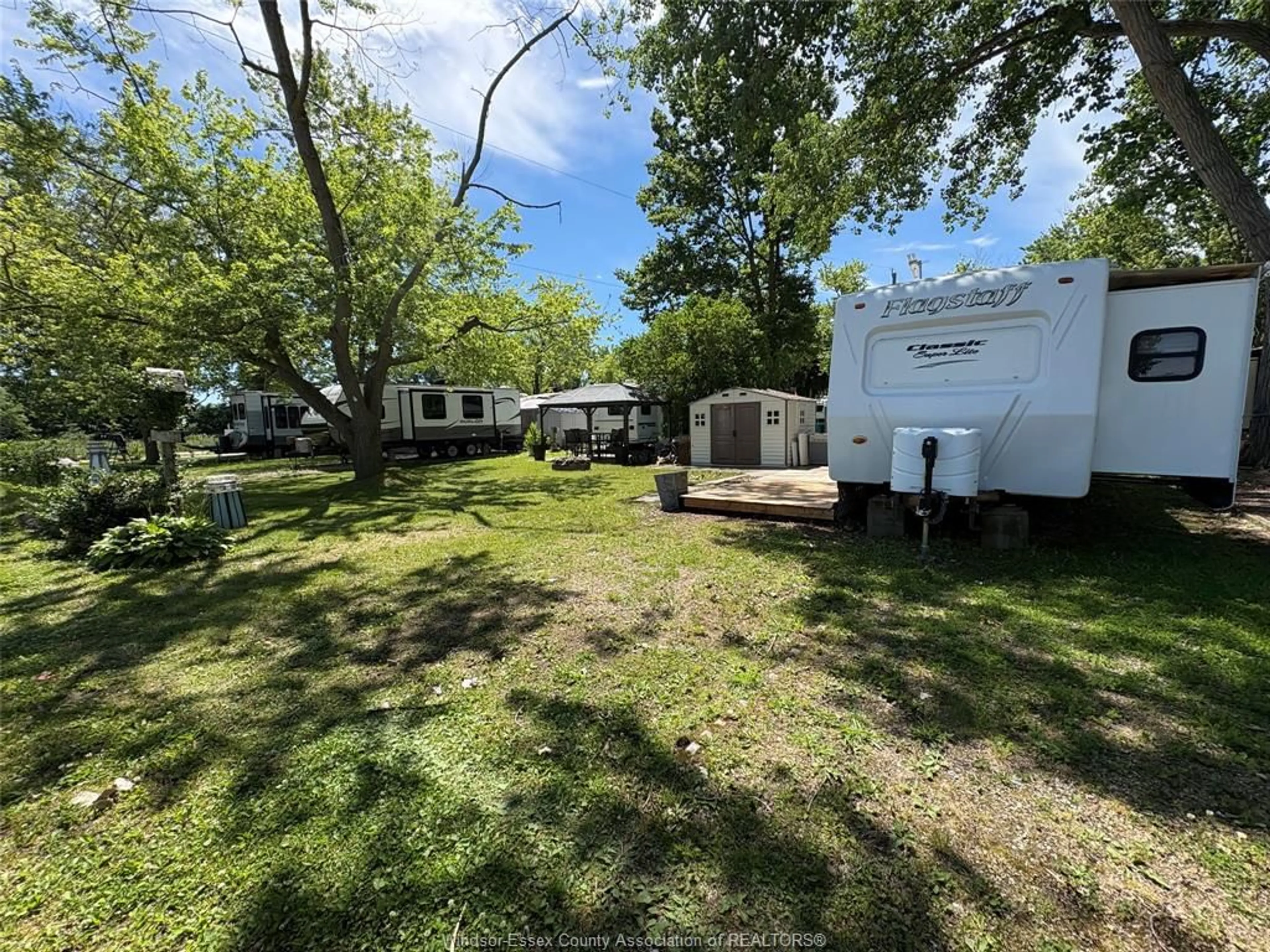 A pic from outside/outdoor area/front of a property/back of a property/a pic from drone, water/lake/river/ocean view for 42 POPLAR Lane, Leamington Ontario N8H 3L4