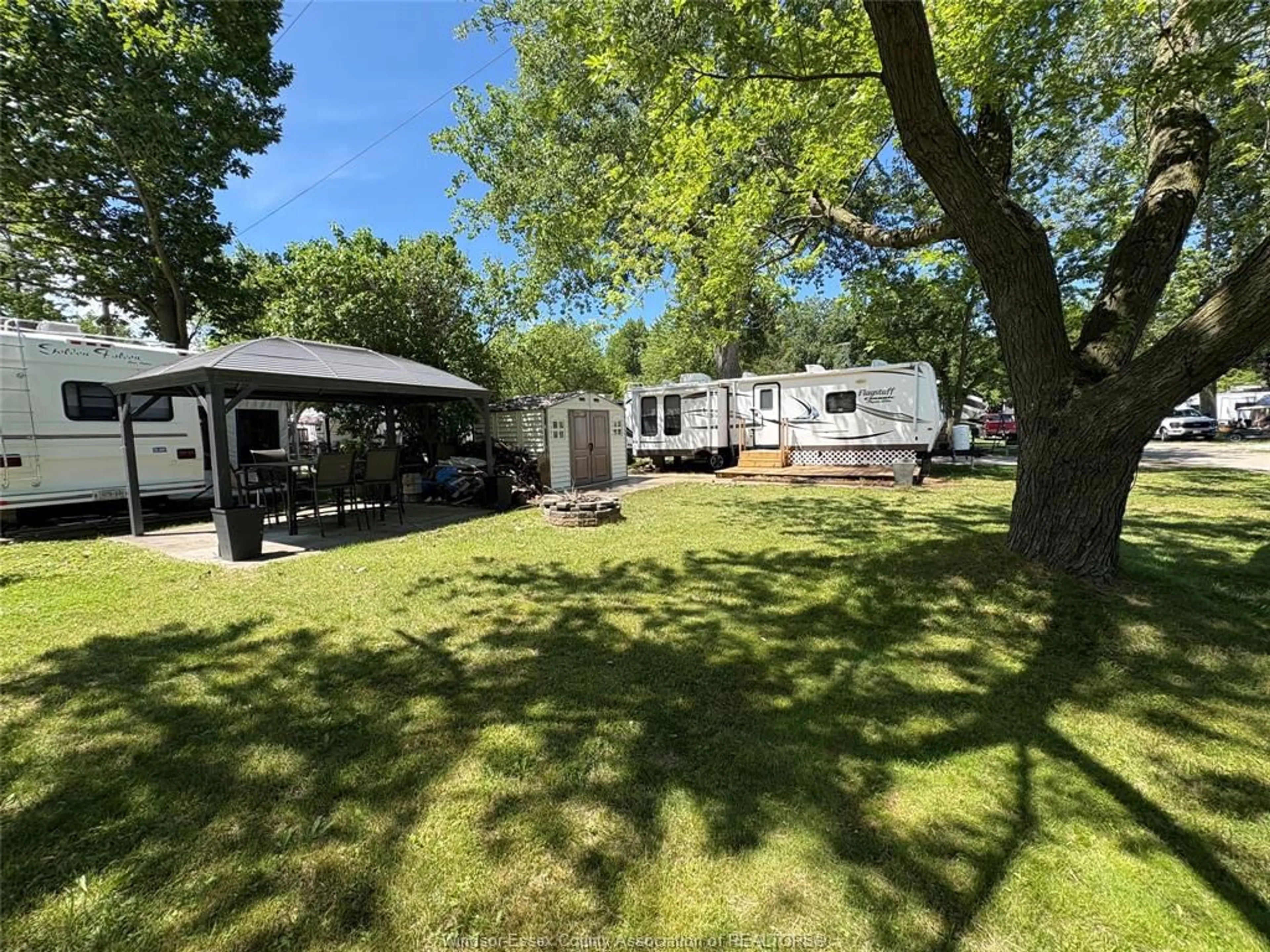 A pic from outside/outdoor area/front of a property/back of a property/a pic from drone, water/lake/river/ocean view for 42 POPLAR Lane, Leamington Ontario N8H 3L4