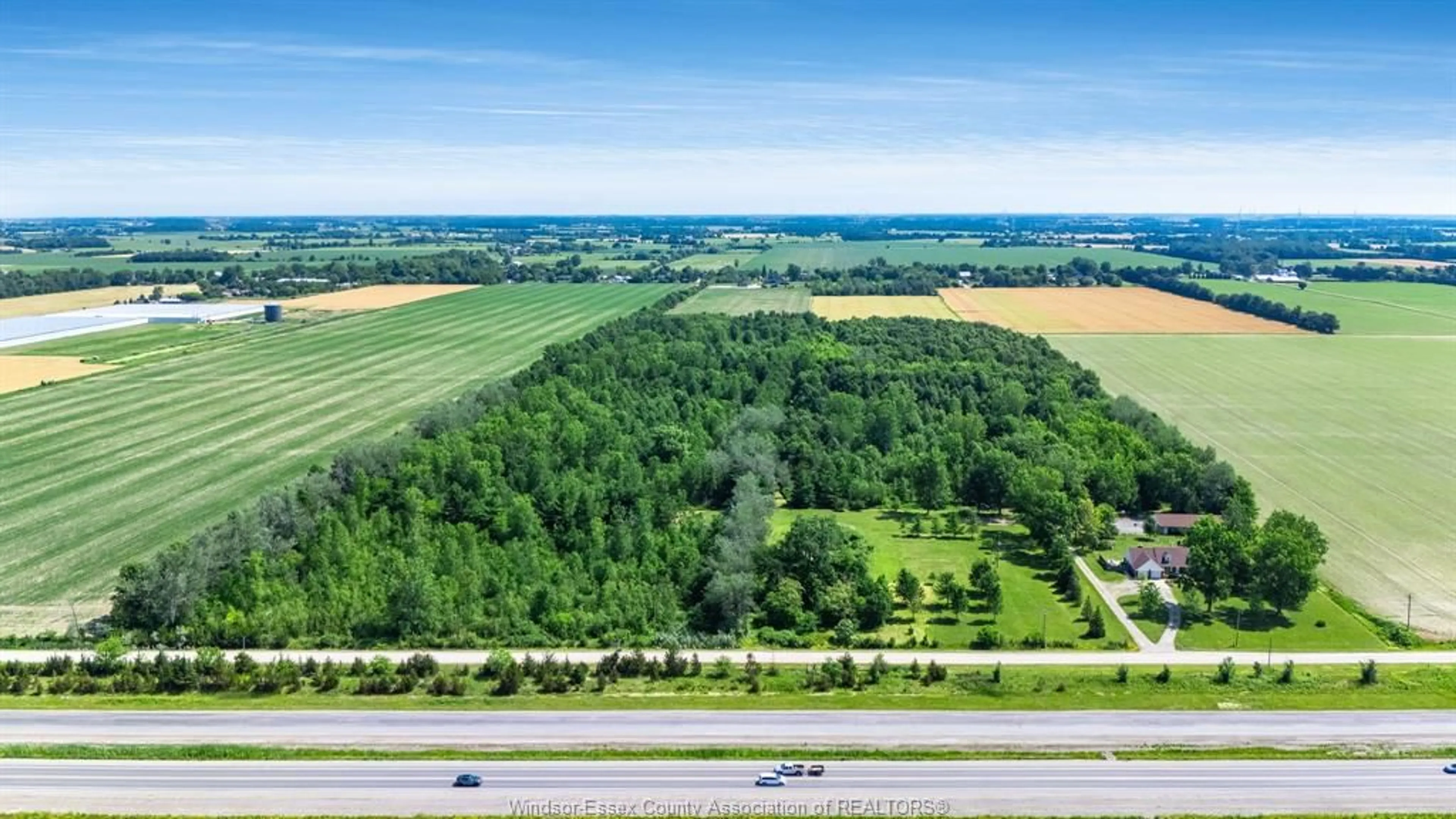 A pic from outside/outdoor area/front of a property/back of a property/a pic from drone, forest/trees view for 383 South Talbot Rd, Kingsville Ontario N8M 2X5