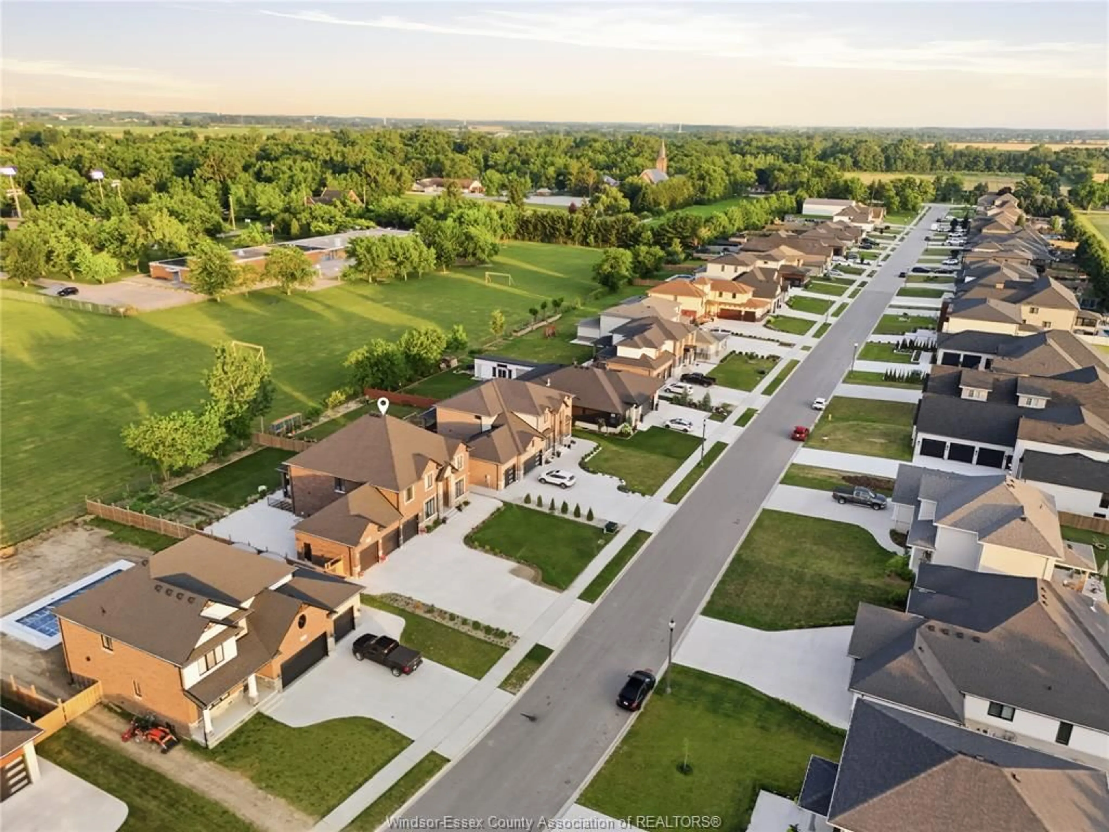 A pic from outside/outdoor area/front of a property/back of a property/a pic from drone, street for 1436 MULLINS Dr, Lakeshore Ontario N0R 1V0