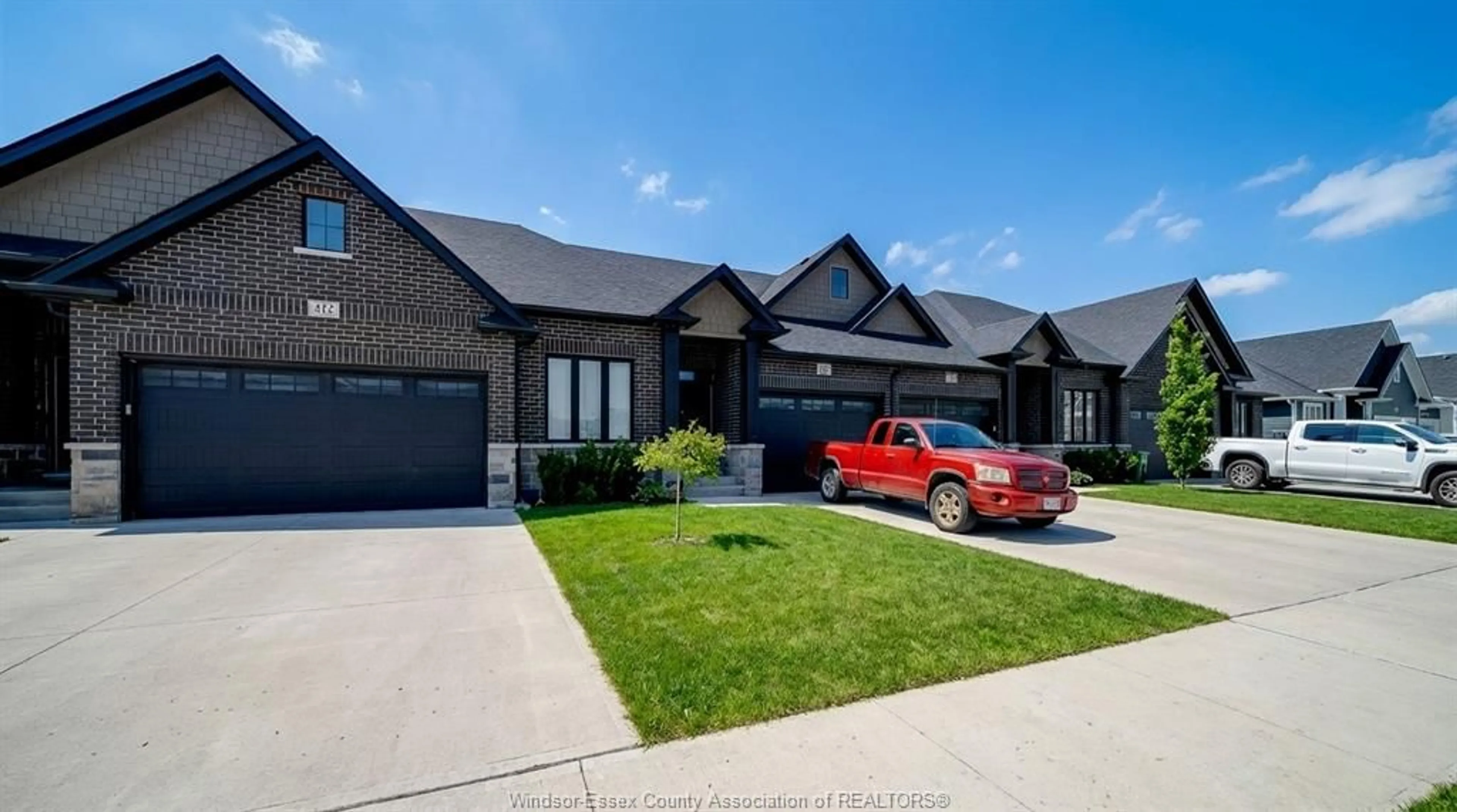 Home with brick exterior material, street for 410 CASERTA Cres, Lakeshore Ontario N0R 1Z0