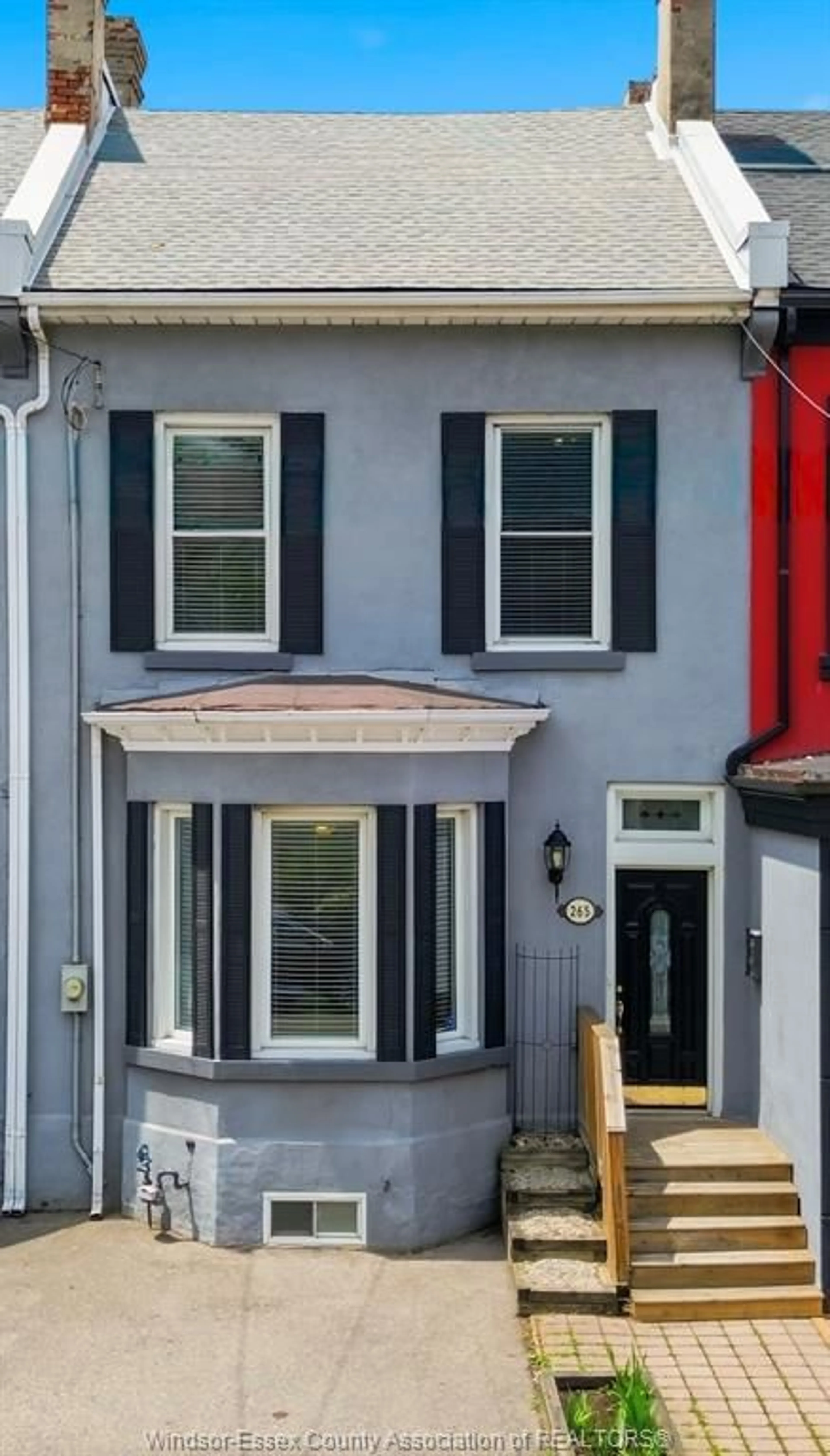 Home with vinyl exterior material, street for 265 MACNAB St, Hamilton Ontario L8L 1K2