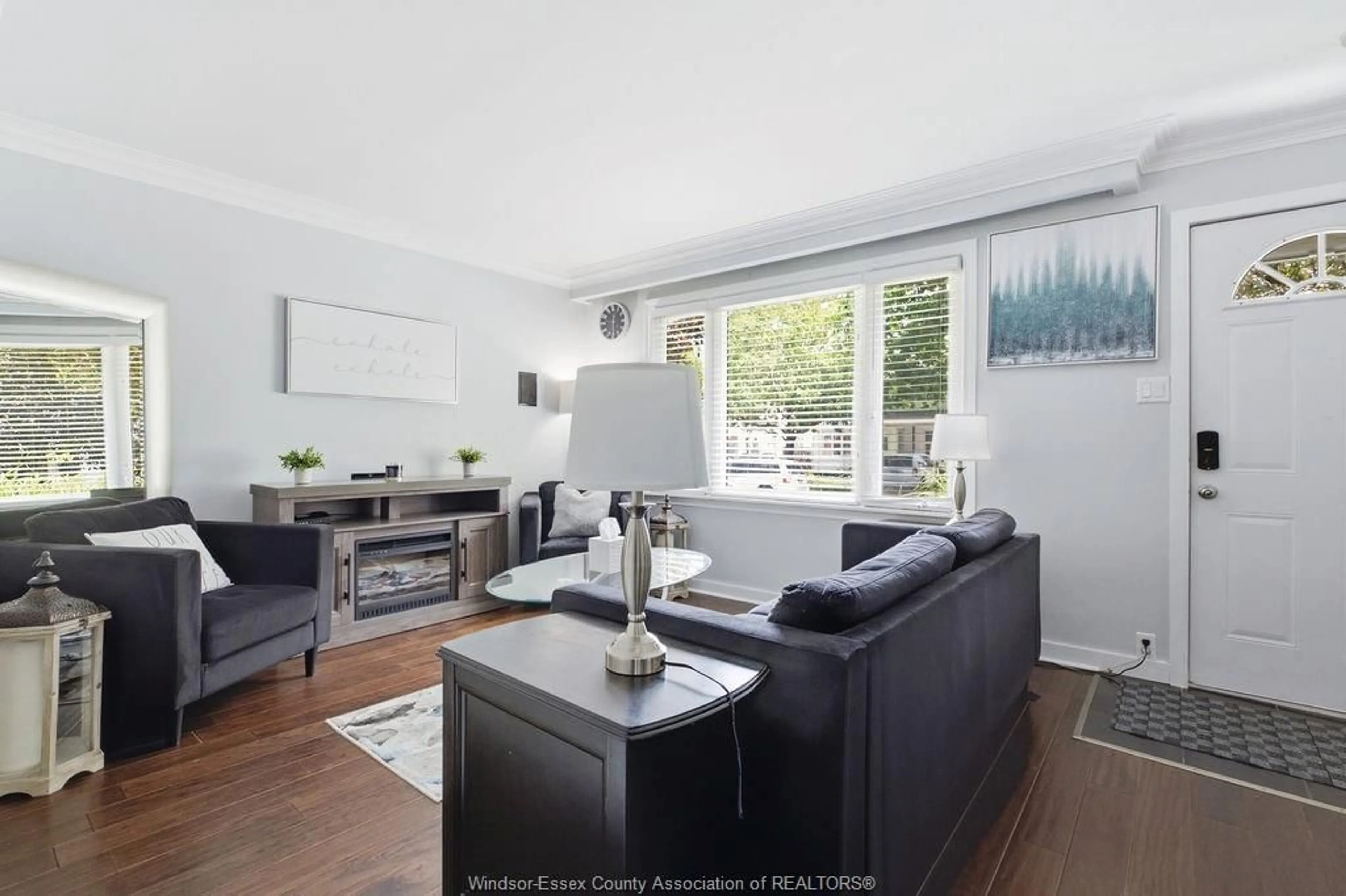 Living room with furniture, wood/laminate floor for 1569 CENTRAL AVE, Windsor Ontario N8Y 2V7