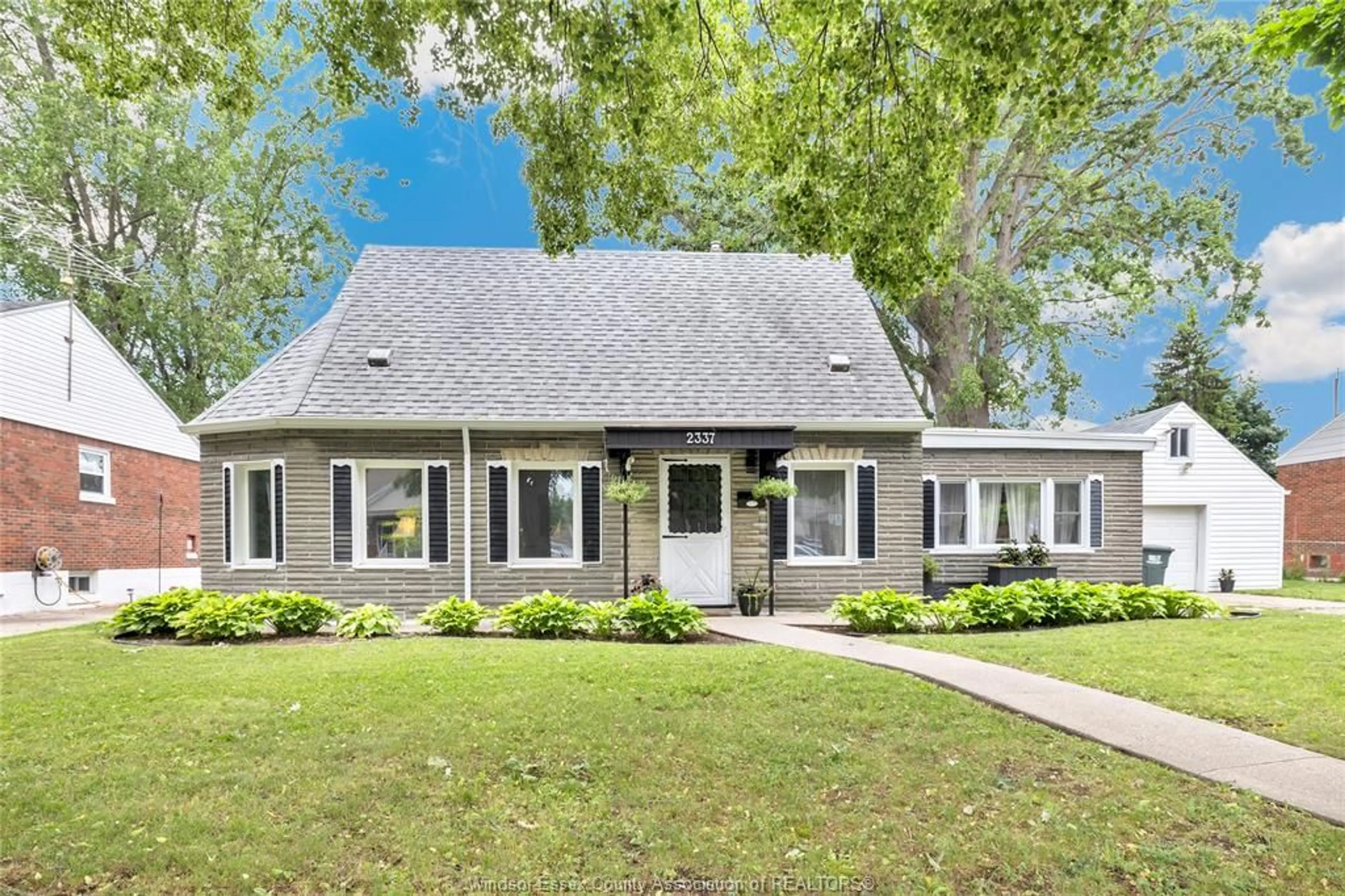 Home with vinyl exterior material, street for 2337 PARKWOOD Ave, Windsor Ontario N8W 2K3