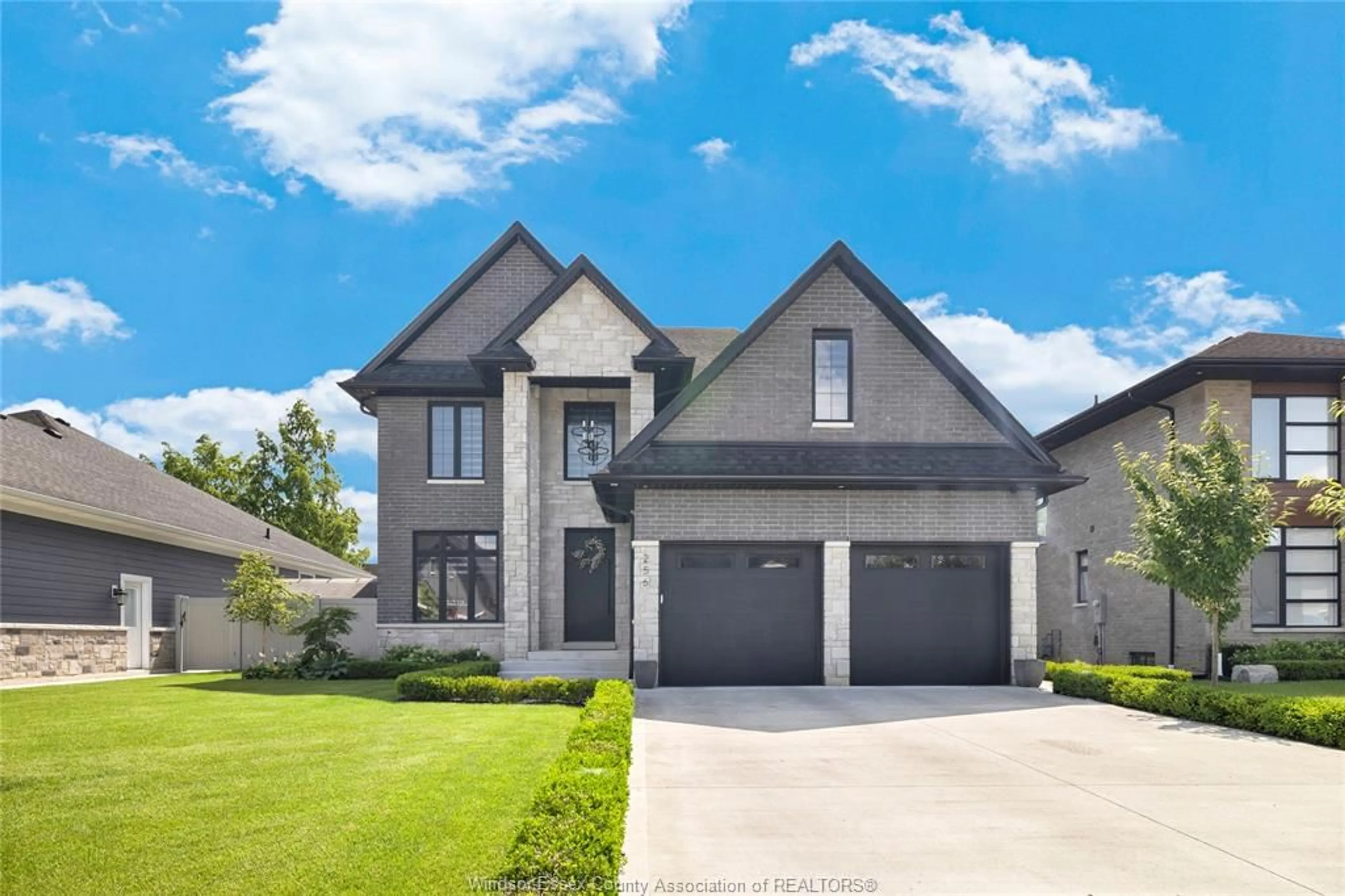 Home with brick exterior material, street for 256 XAVIER Cir, Lakeshore Ontario N0R 1A0