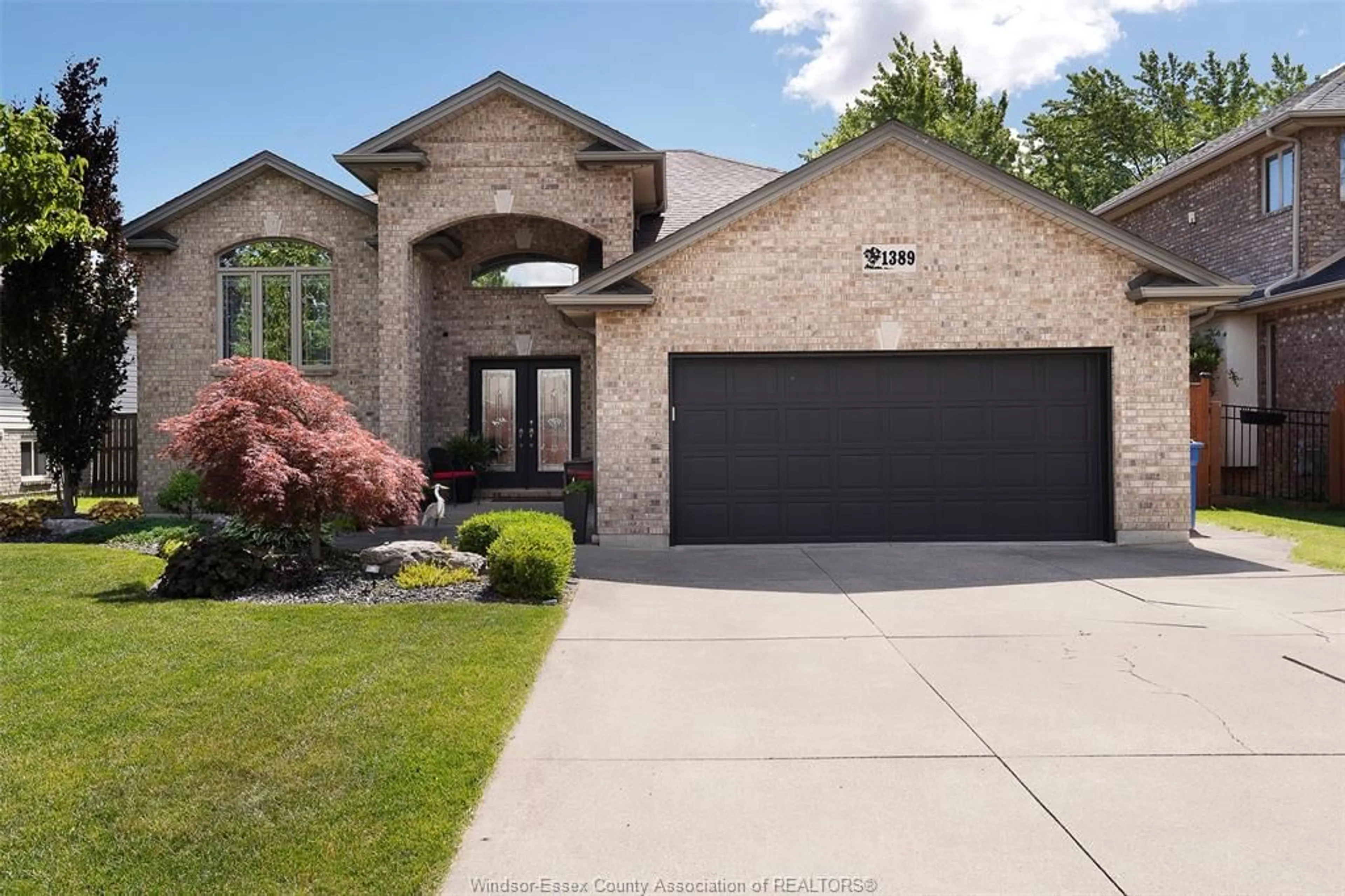 Home with brick exterior material, street for 1389 CROSSWINDS Dr, Lakeshore Ontario N8L 0S6