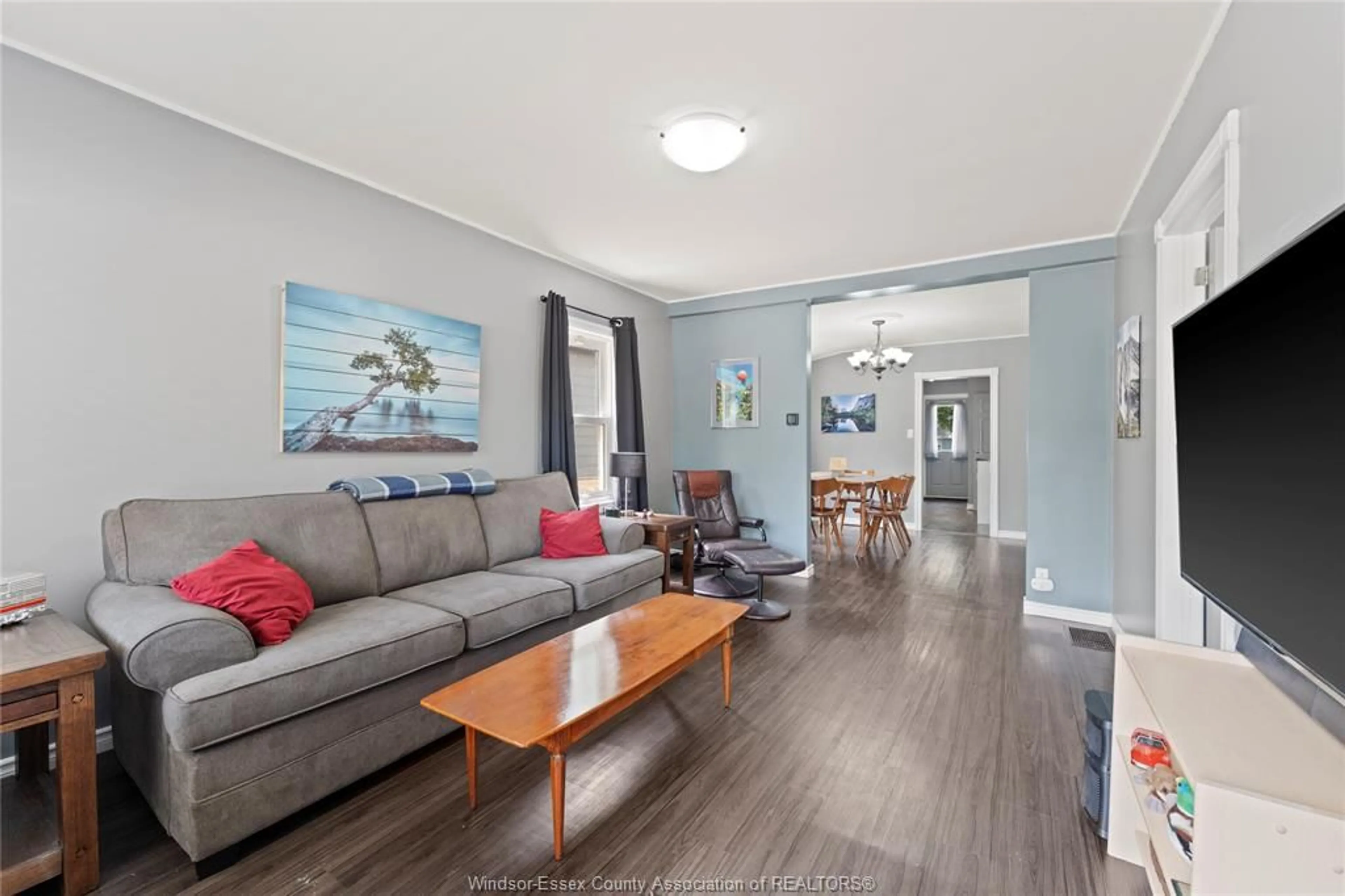 Living room with furniture, wood/laminate floor for 729 William St., Tecumseh Ontario N8N 2A2