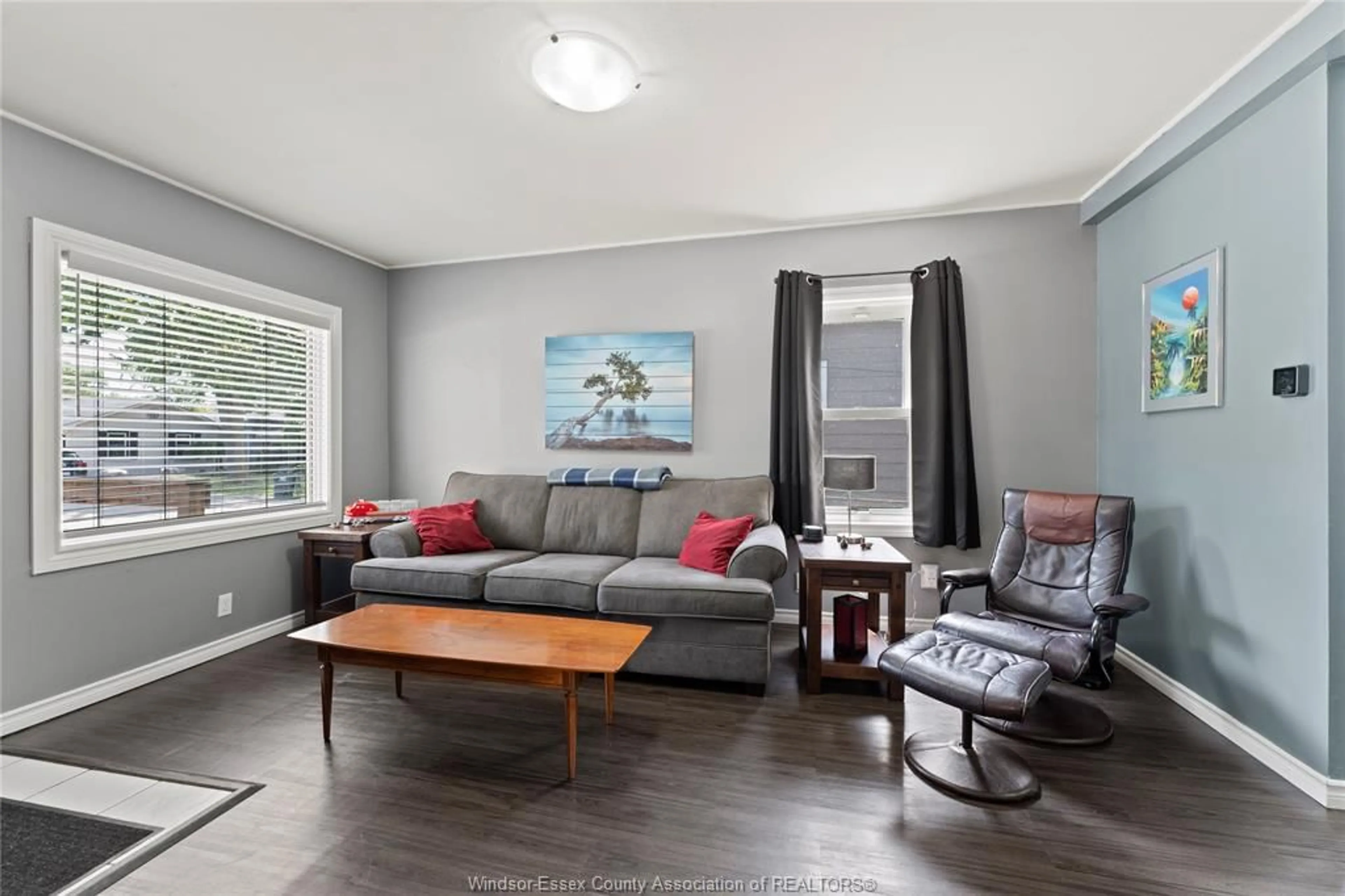 Living room with furniture, wood/laminate floor for 729 William St., Tecumseh Ontario N8N 2A2