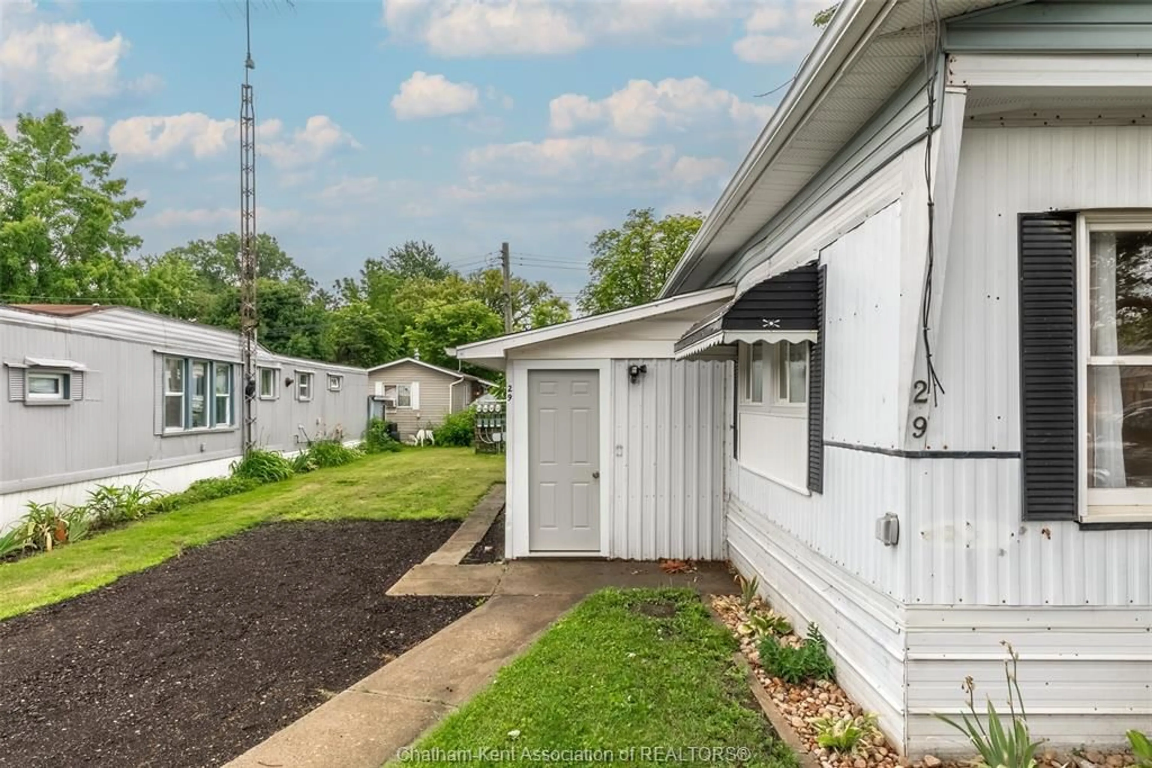 Home with vinyl exterior material, street for 9480 Longwoods Rd #29, Chatham Ontario N7M 5J7