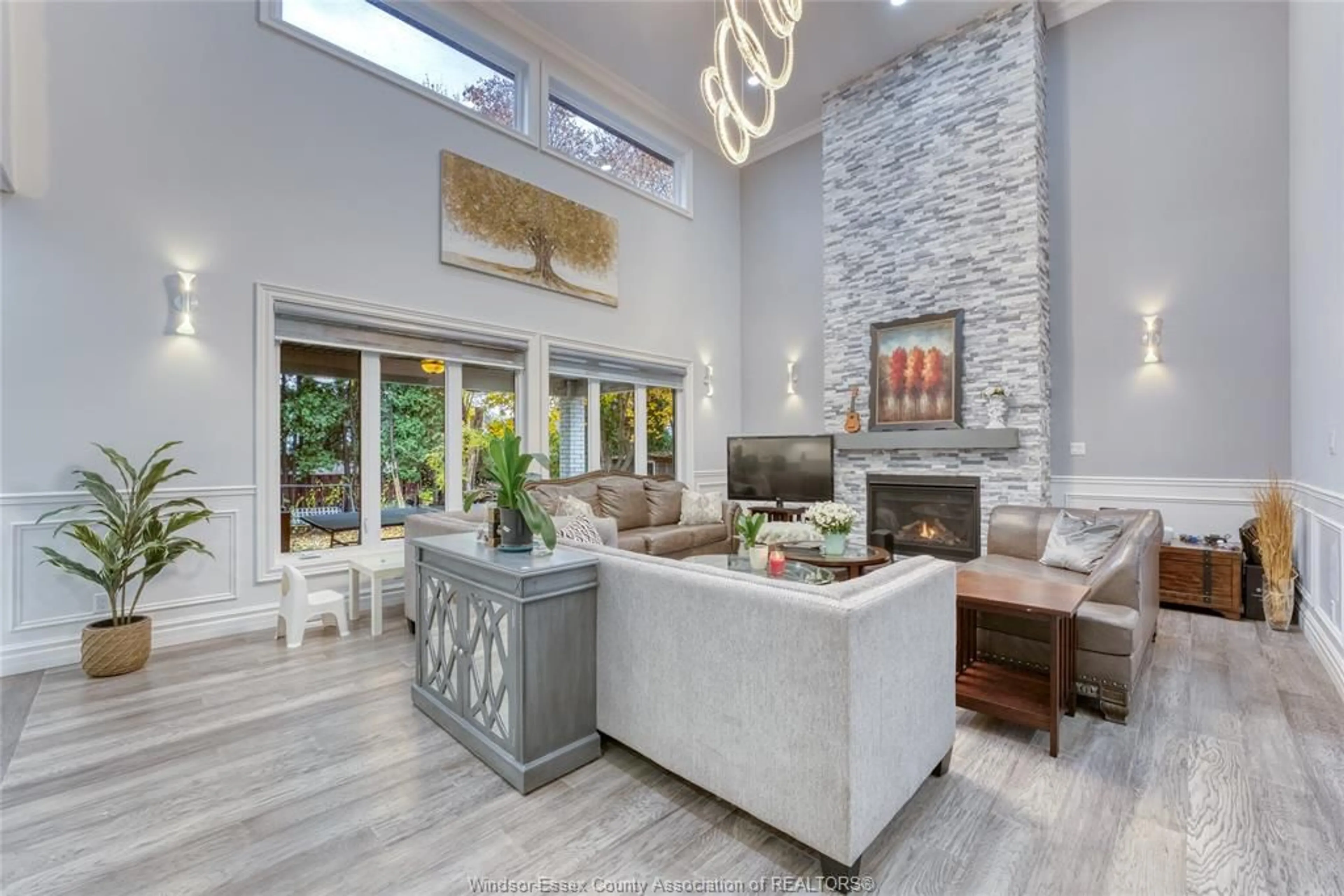 Living room with furniture, ceramic/tile floor for 735 CABANA Rd, Windsor Ontario N9G 1B5
