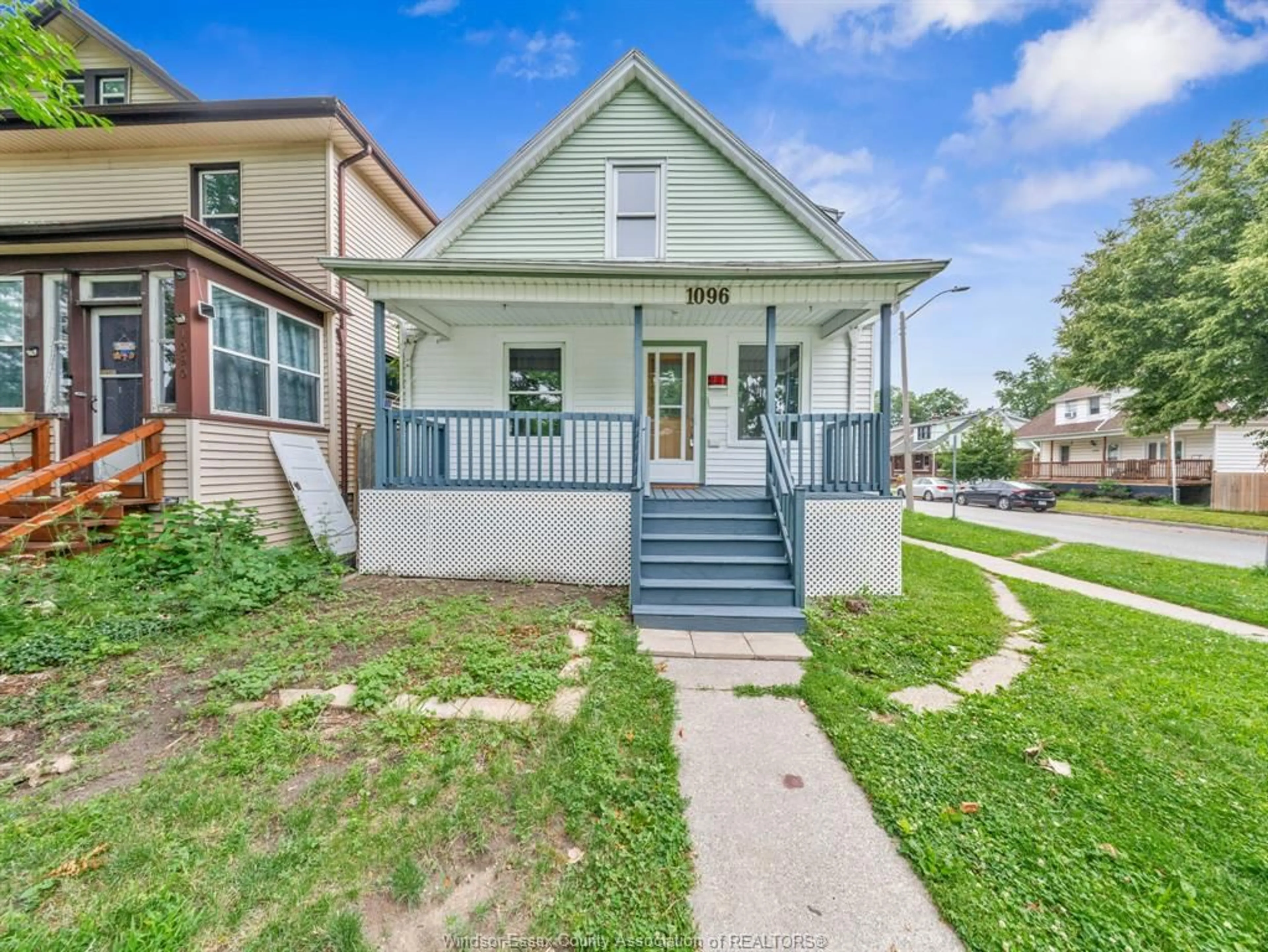 Home with vinyl exterior material, street for 1096 HALL, Windsor Ontario N9A 2M7