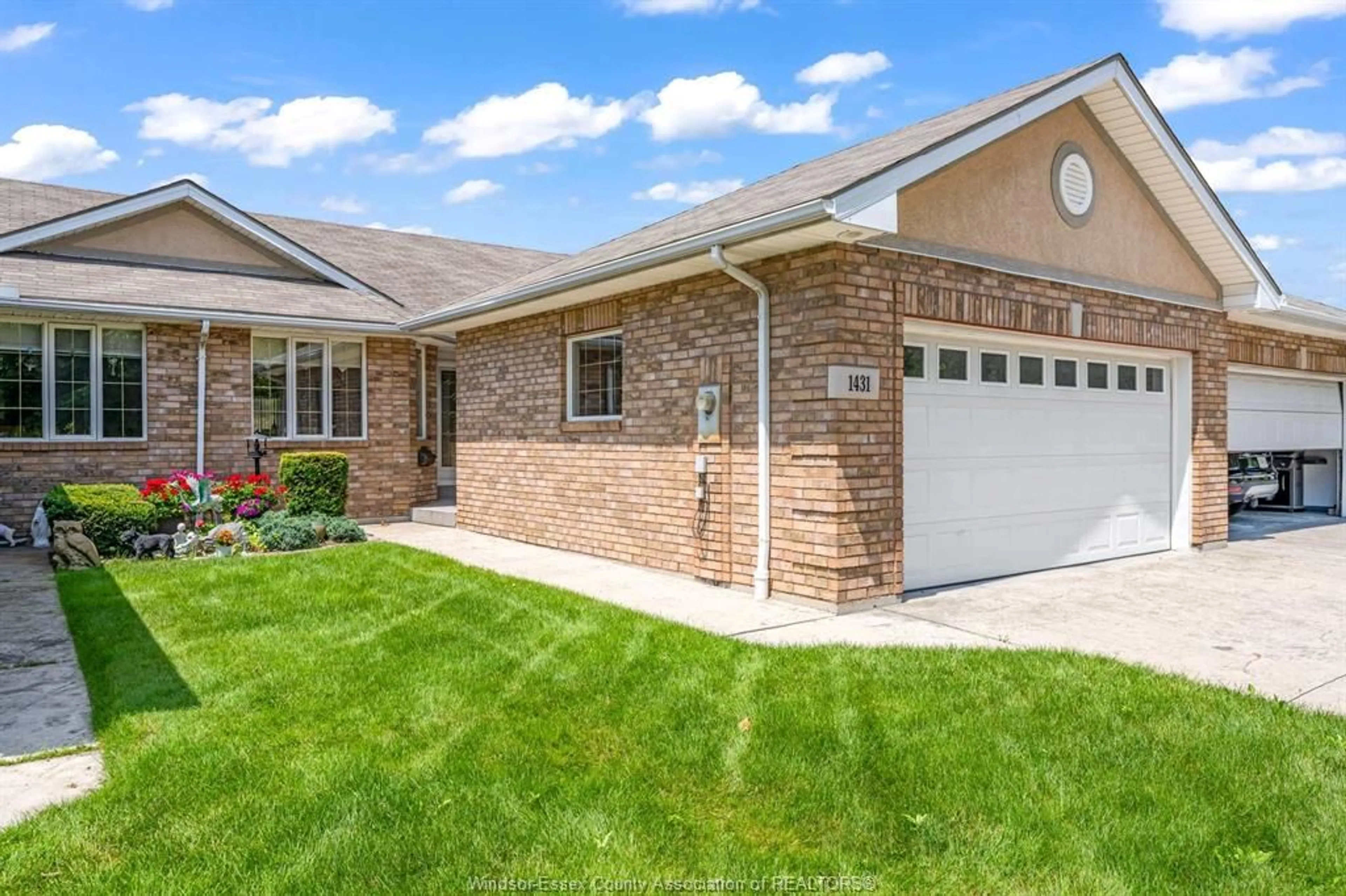 Home with brick exterior material, street for 1431 Blue Heron Dr, Windsor Ontario N8P 1L5