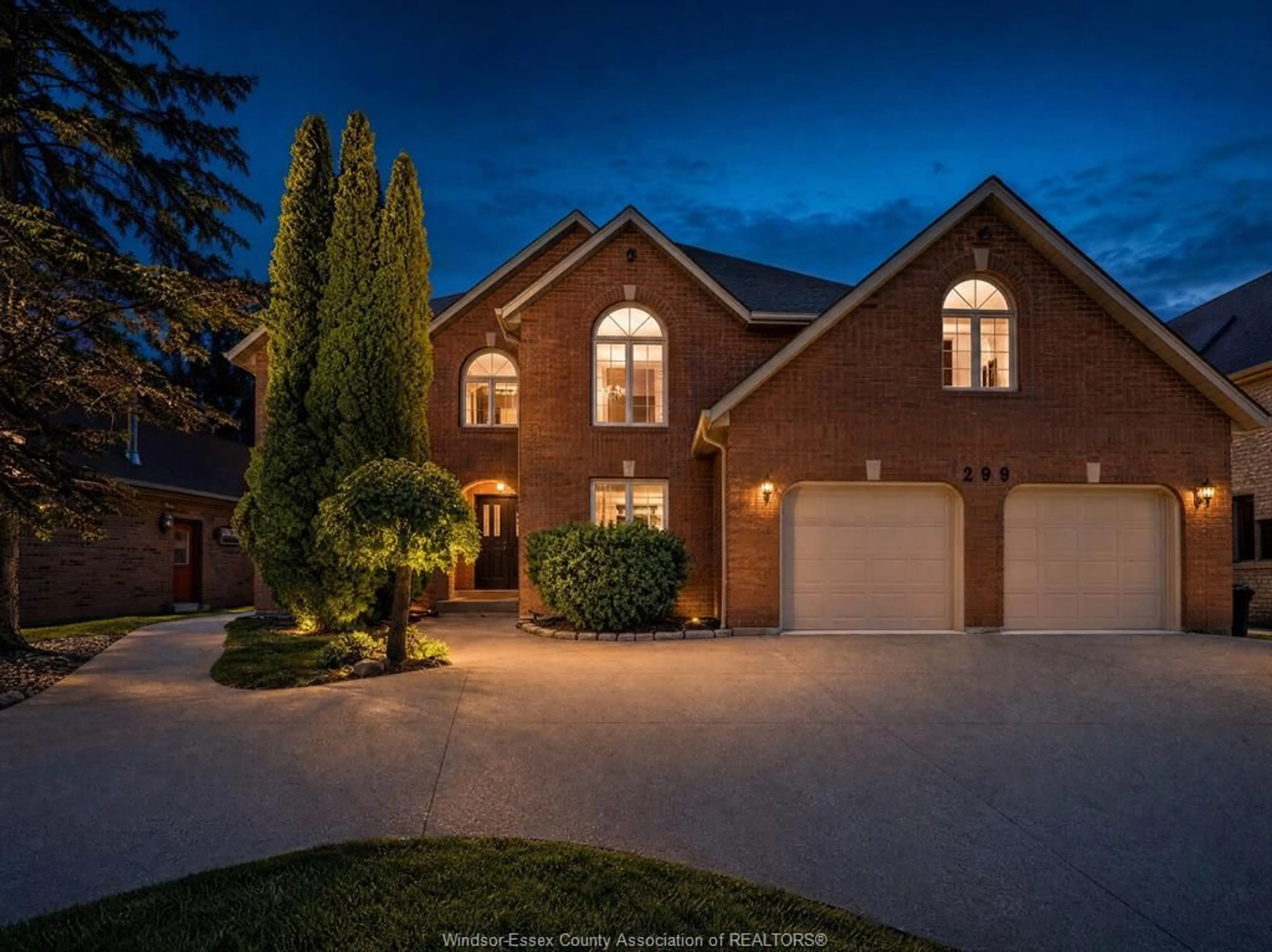 Home with brick exterior material, street for 299 RUSSEL WOODS Dr, Tecumseh Ontario N8N 4K4