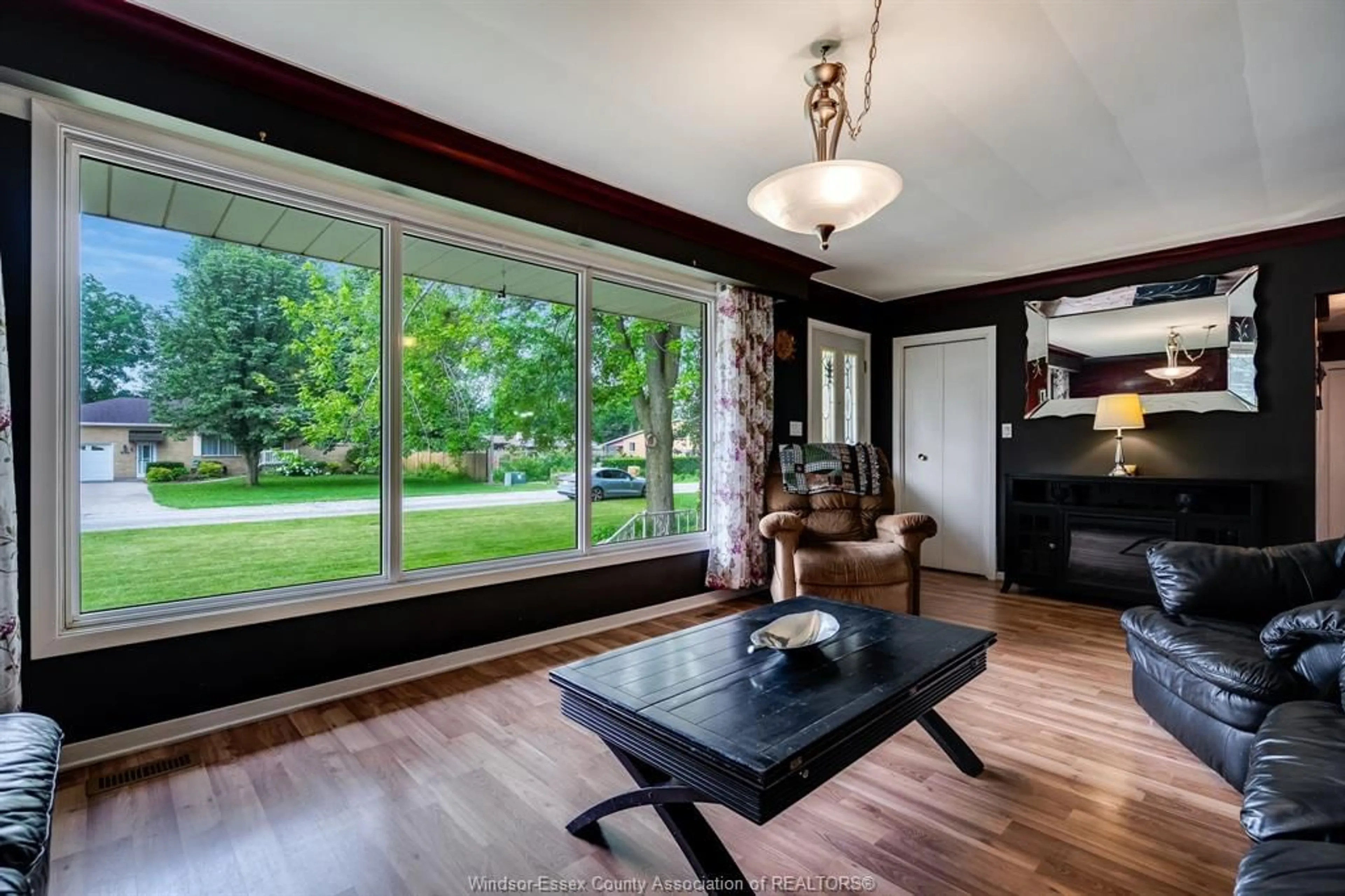 Living room with furniture, wood/laminate floor for 166 Kael Cres, Harrow Ontario N0R 1G0