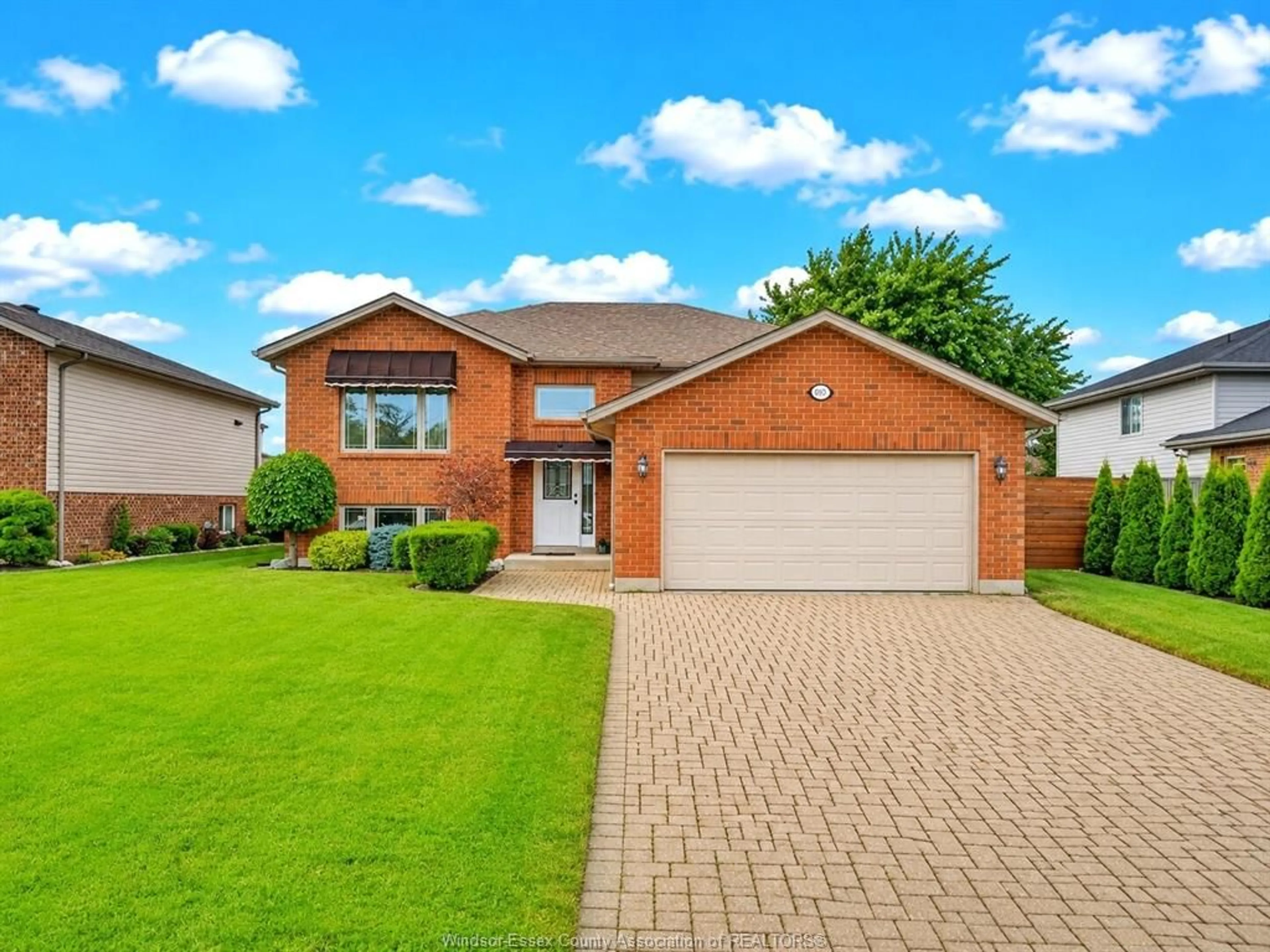 Home with brick exterior material, street for 890 SOUTHWOOD Dr, Lakeshore Ontario N0R 1A0