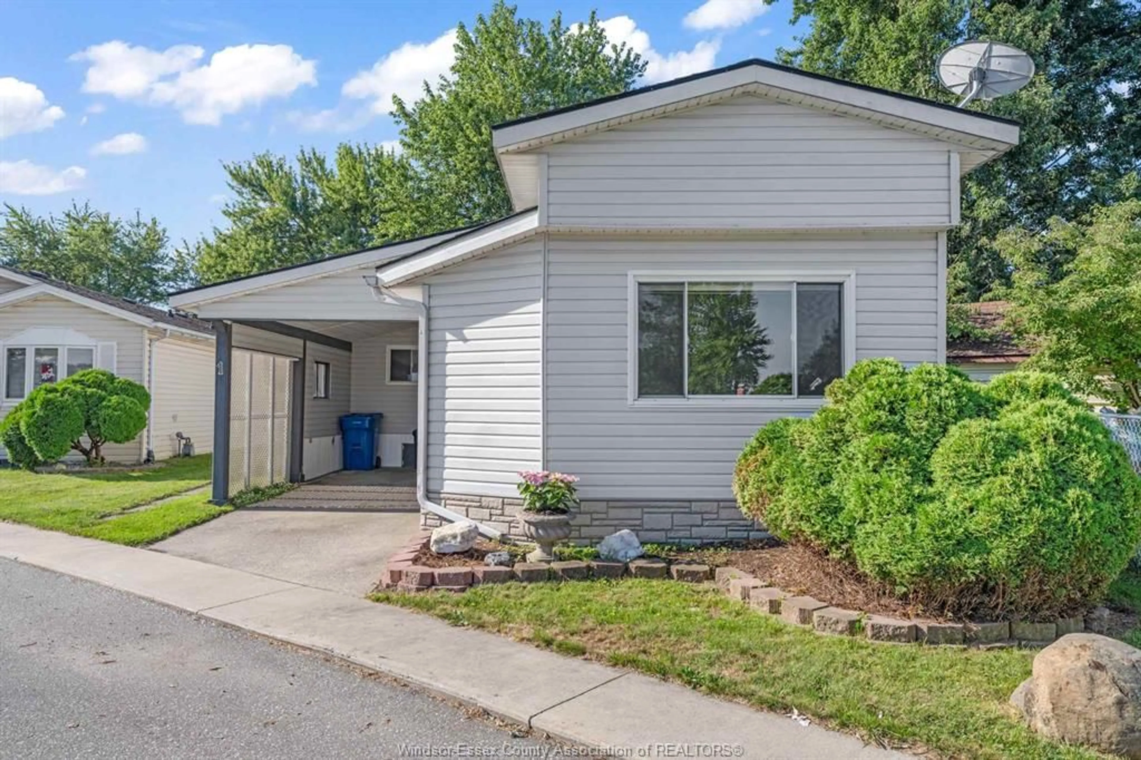 Home with vinyl exterior material, street for 1 Spruce St, McGregor Ontario N0R 1J0