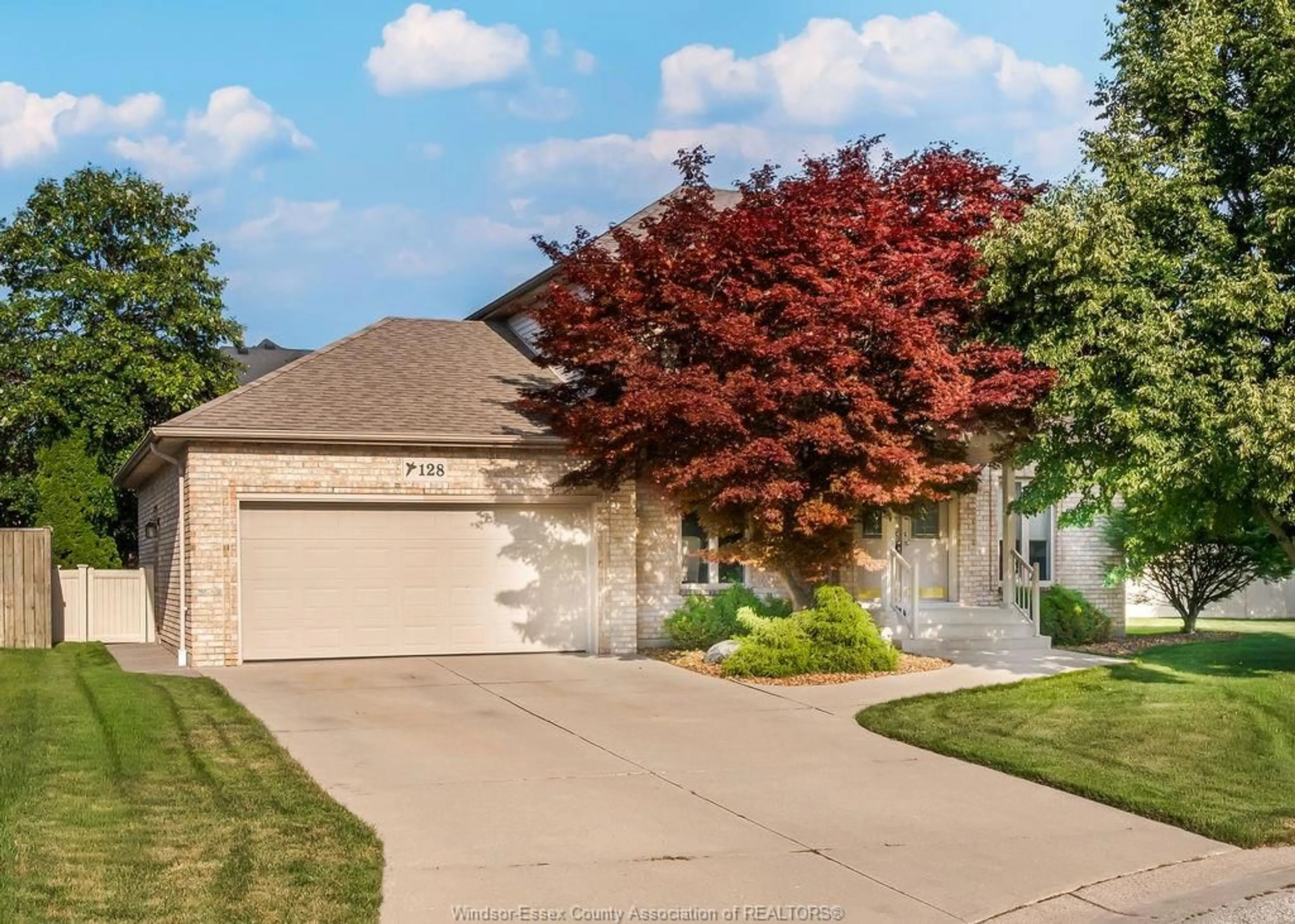 Home with brick exterior material, street for 128 Pheasant Run Dr, Lakeshore Ontario N8L 0Z7
