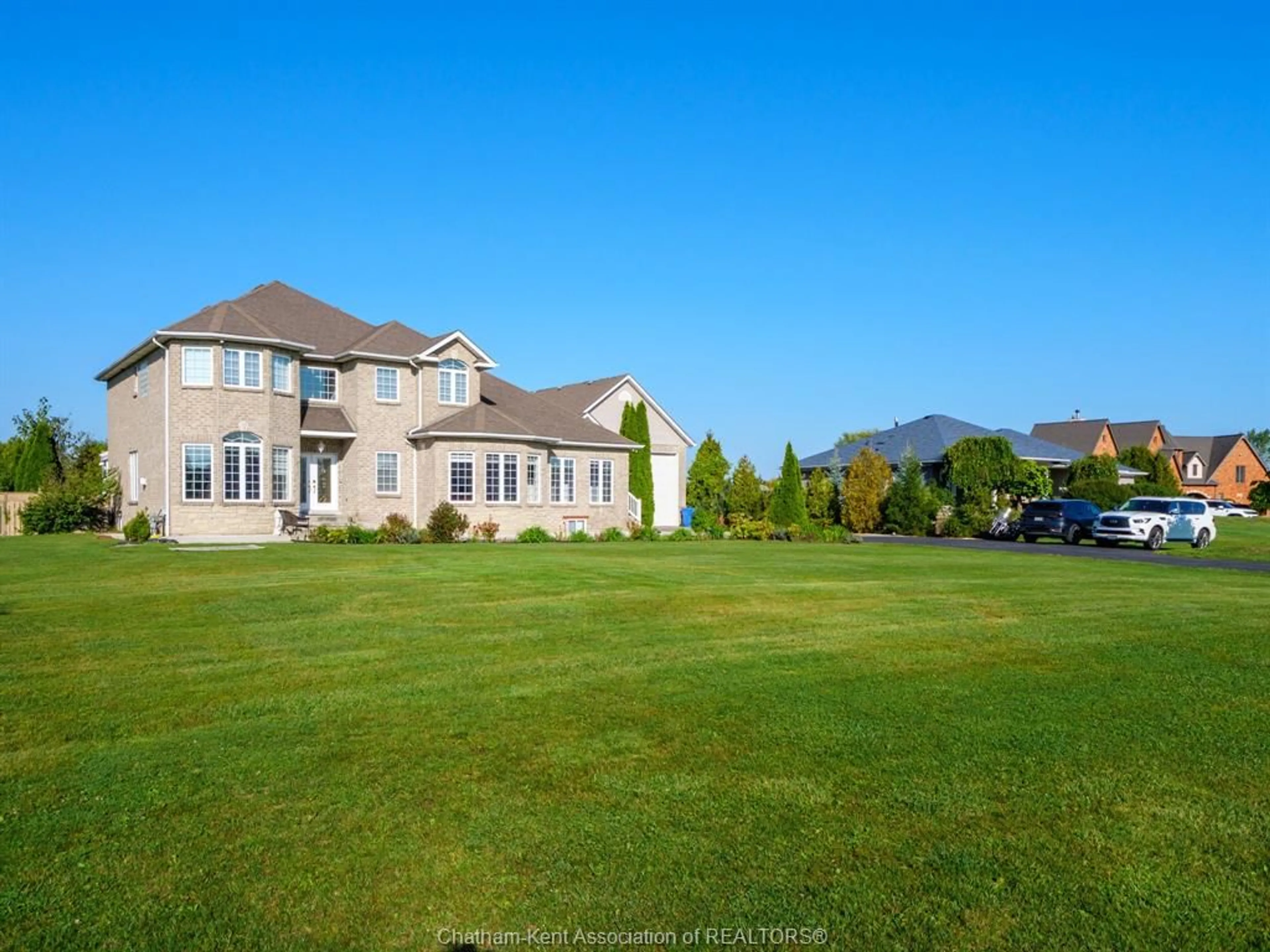 A pic from outside/outdoor area/front of a property/back of a property/a pic from drone, mountain view for 1951 County Rd 27 ..., Woodslee Ontario N0R 1V0