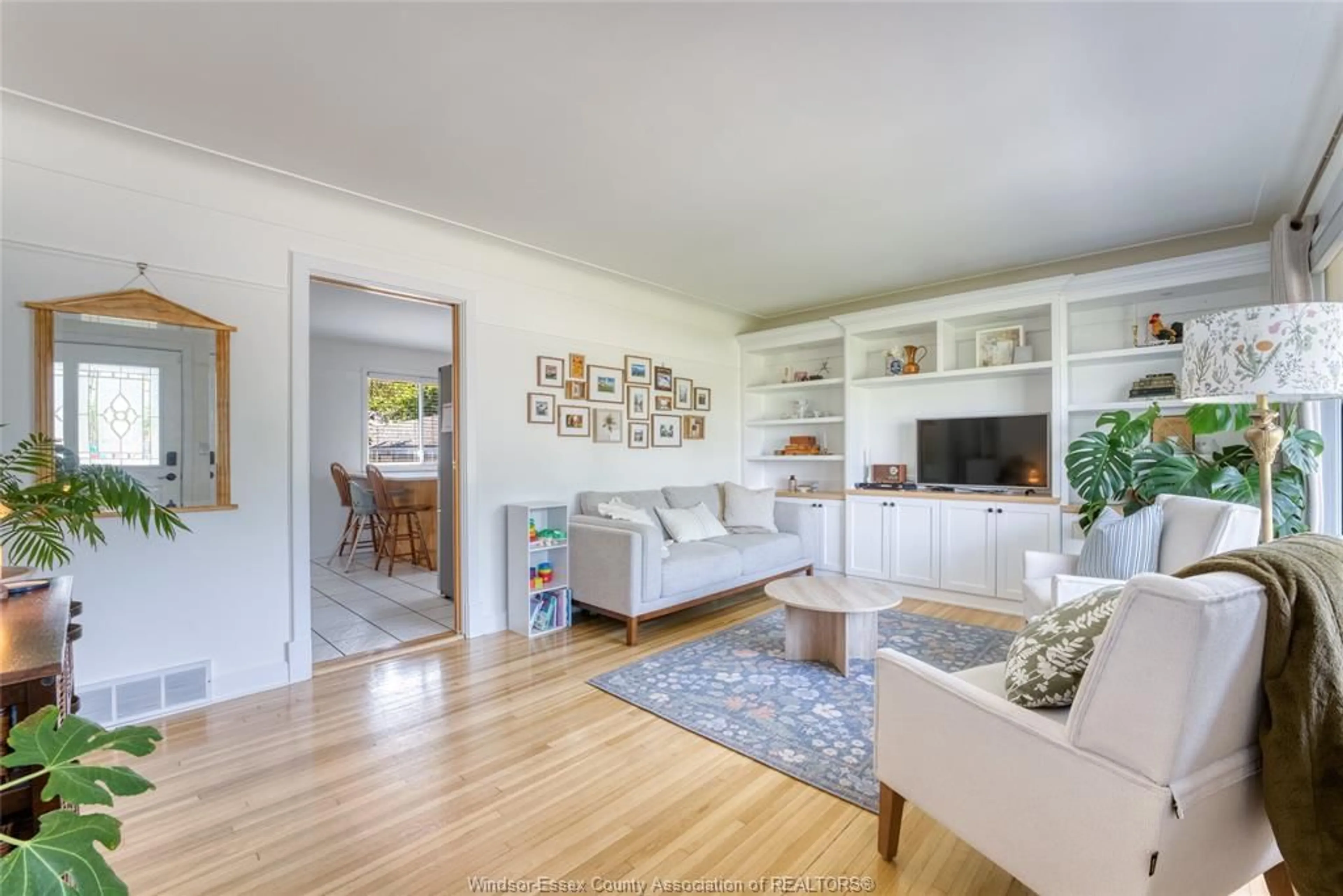 Living room with furniture, wood/laminate floor for 14001 WALKER ROAD, Essex Ontario N0R 1J0