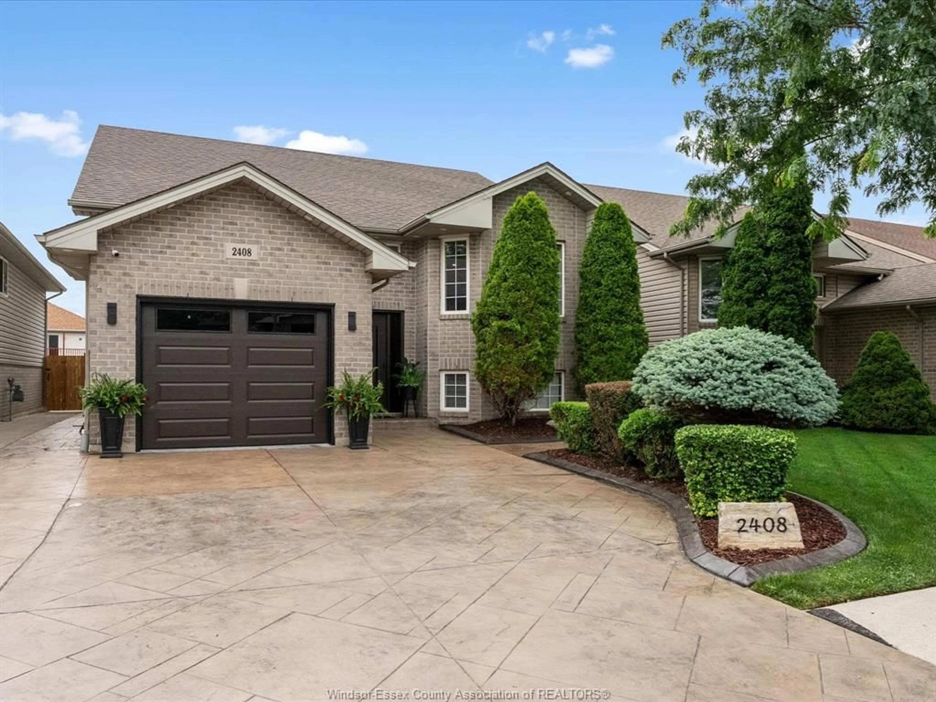 Home with brick exterior material, street for 2408 WATERFORD Ave, Windsor Ontario N8P 1S1