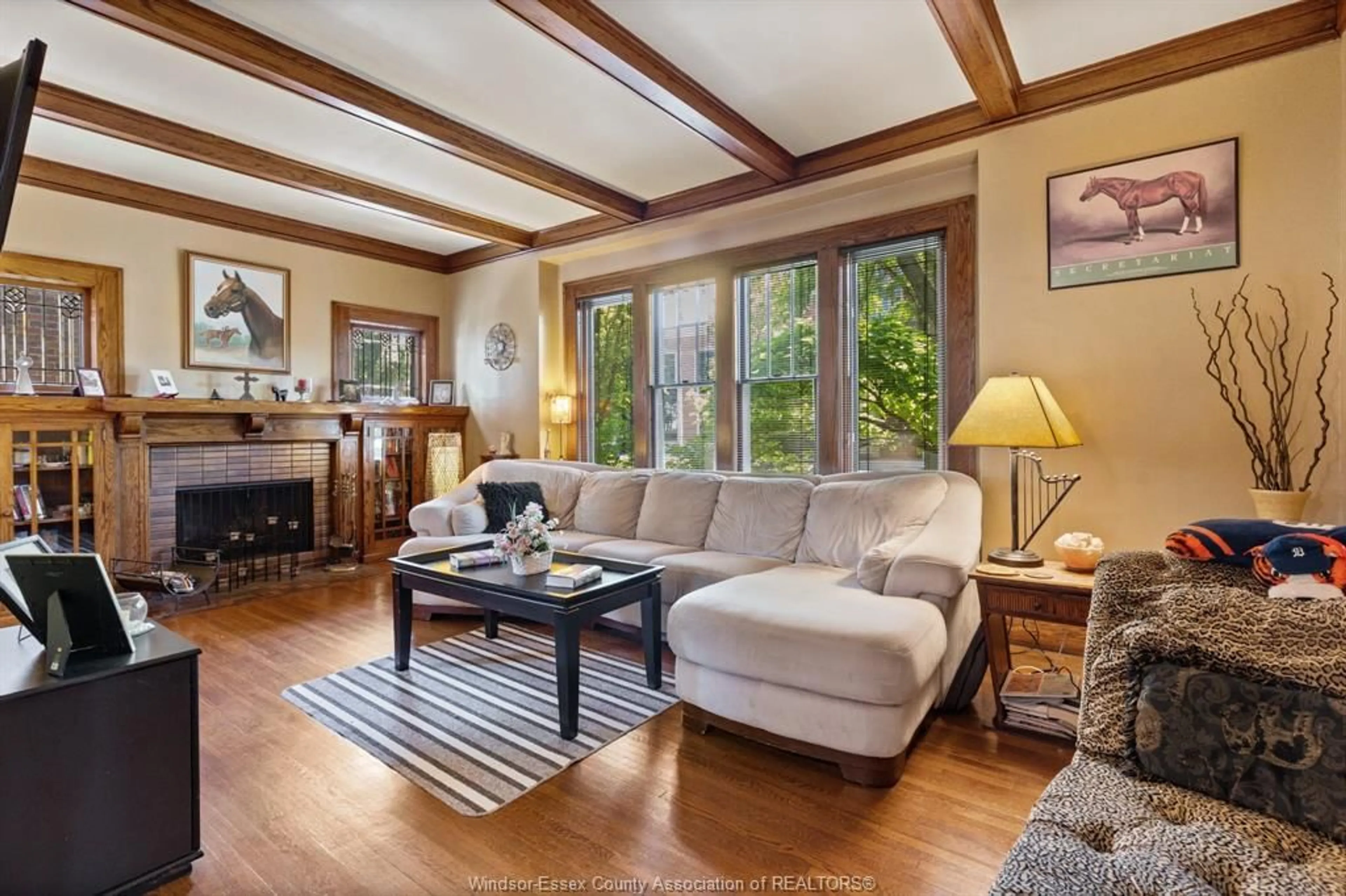 Living room with furniture, wood/laminate floor for 858 CHILVER, Windsor Ontario N8Y 2K4