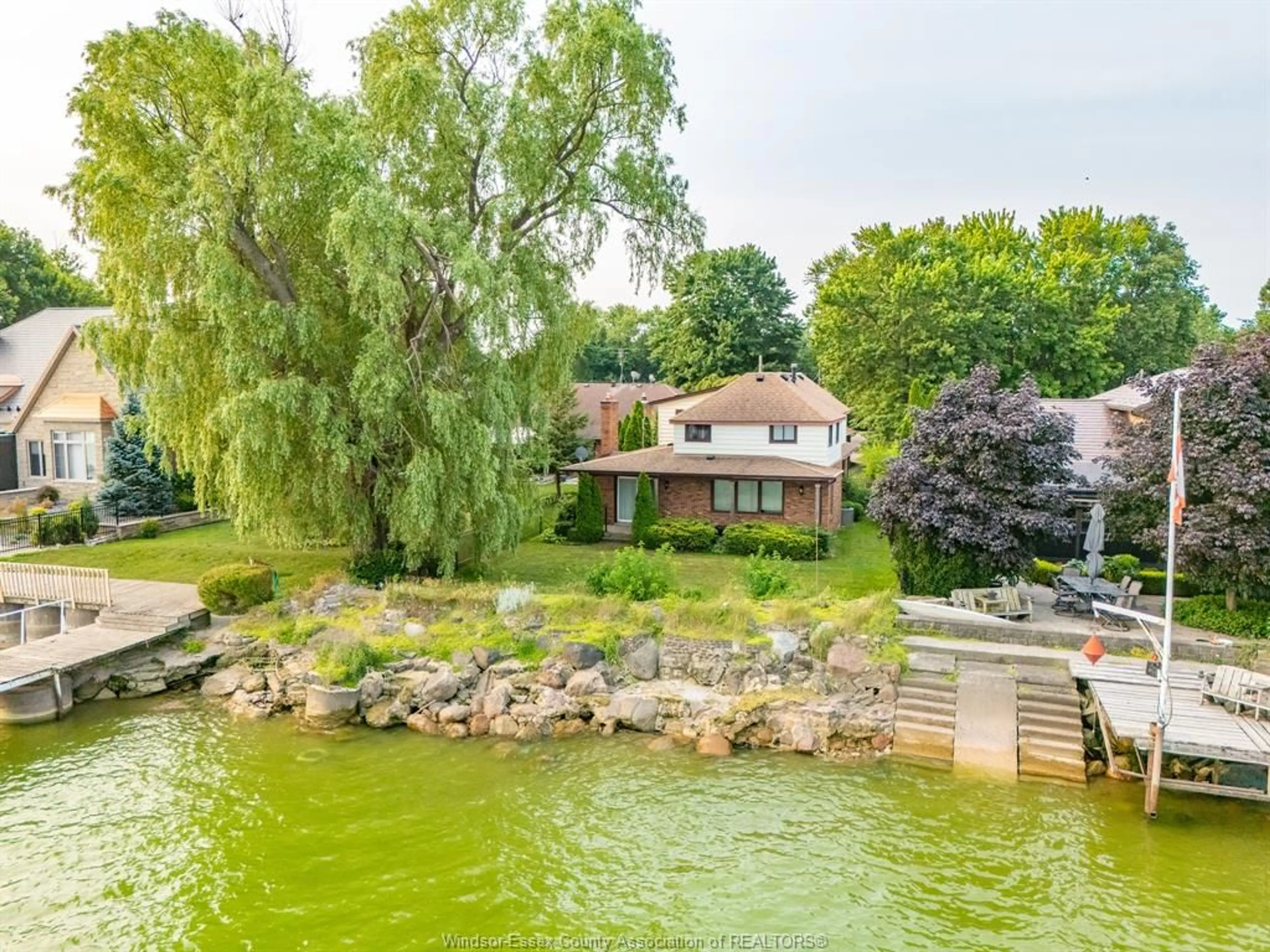 A pic from outside/outdoor area/front of a property/back of a property/a pic from drone, water/lake/river/ocean view for 329 Lakeview Dr, Belle River Ontario N8L 0M2