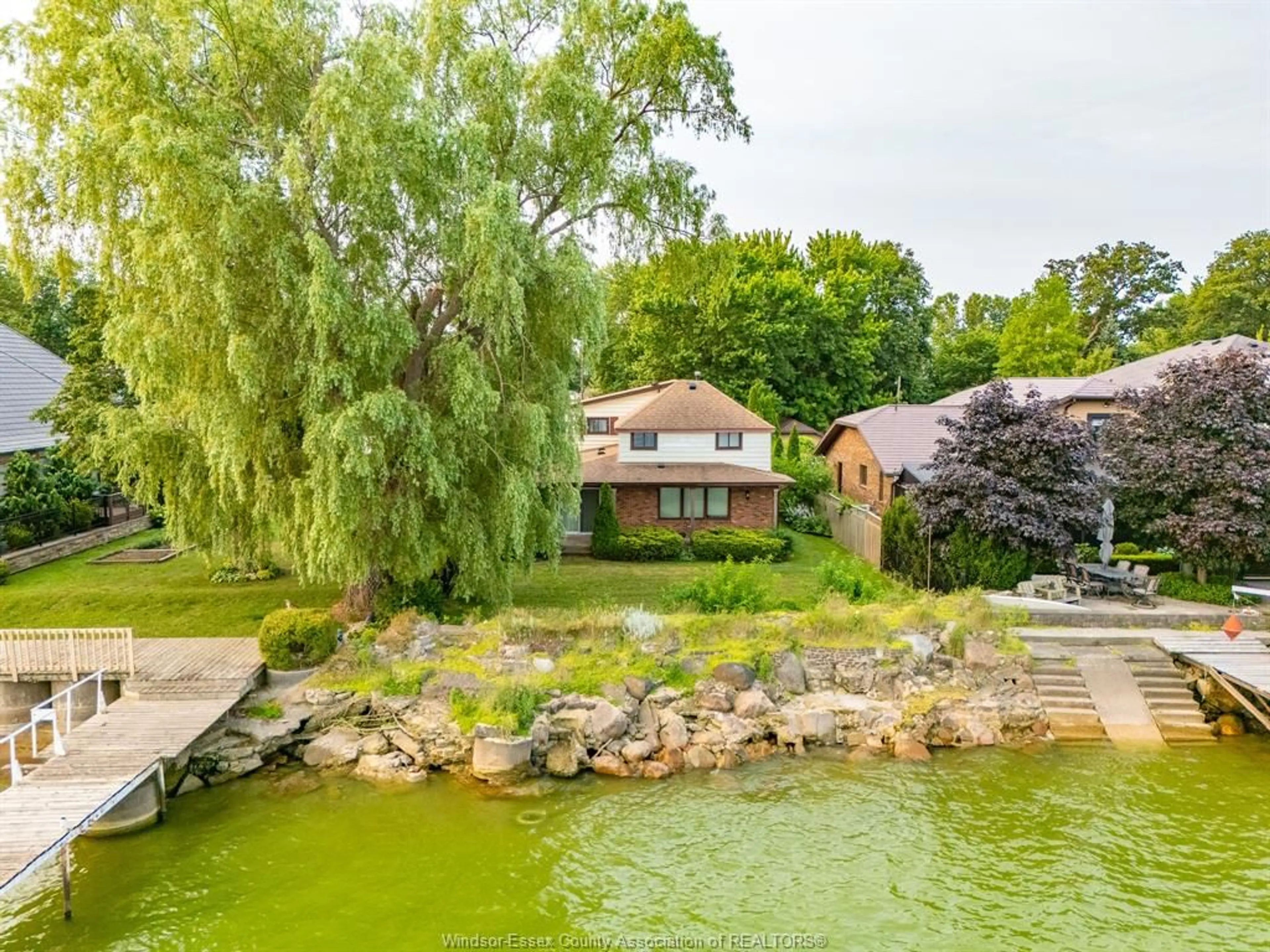 A pic from outside/outdoor area/front of a property/back of a property/a pic from drone, water/lake/river/ocean view for 329 Lakeview Dr, Belle River Ontario N8L 0M2
