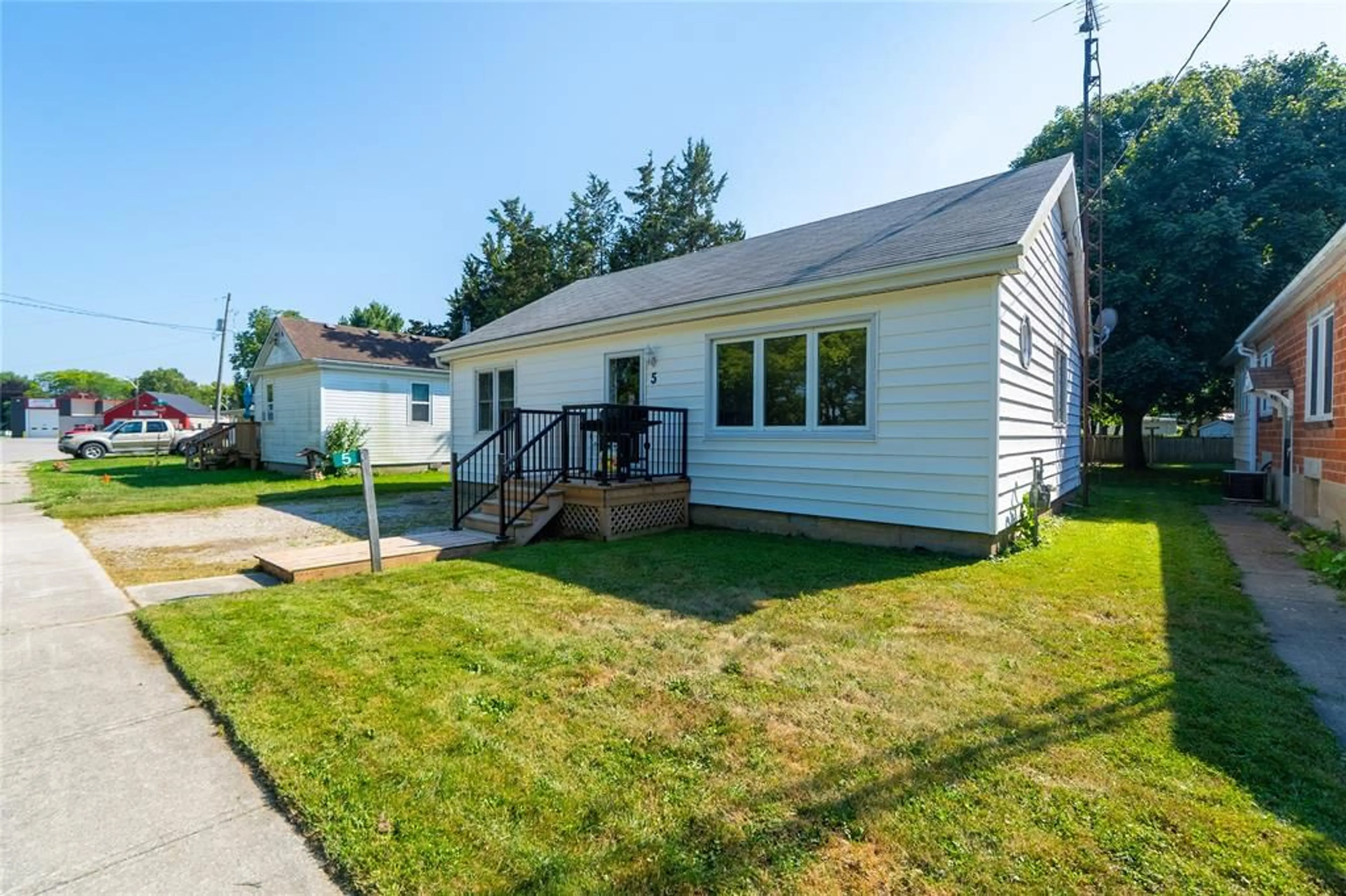 Home with vinyl exterior material, street for 5 Bank St, Tupperville Ontario N0P 2H0