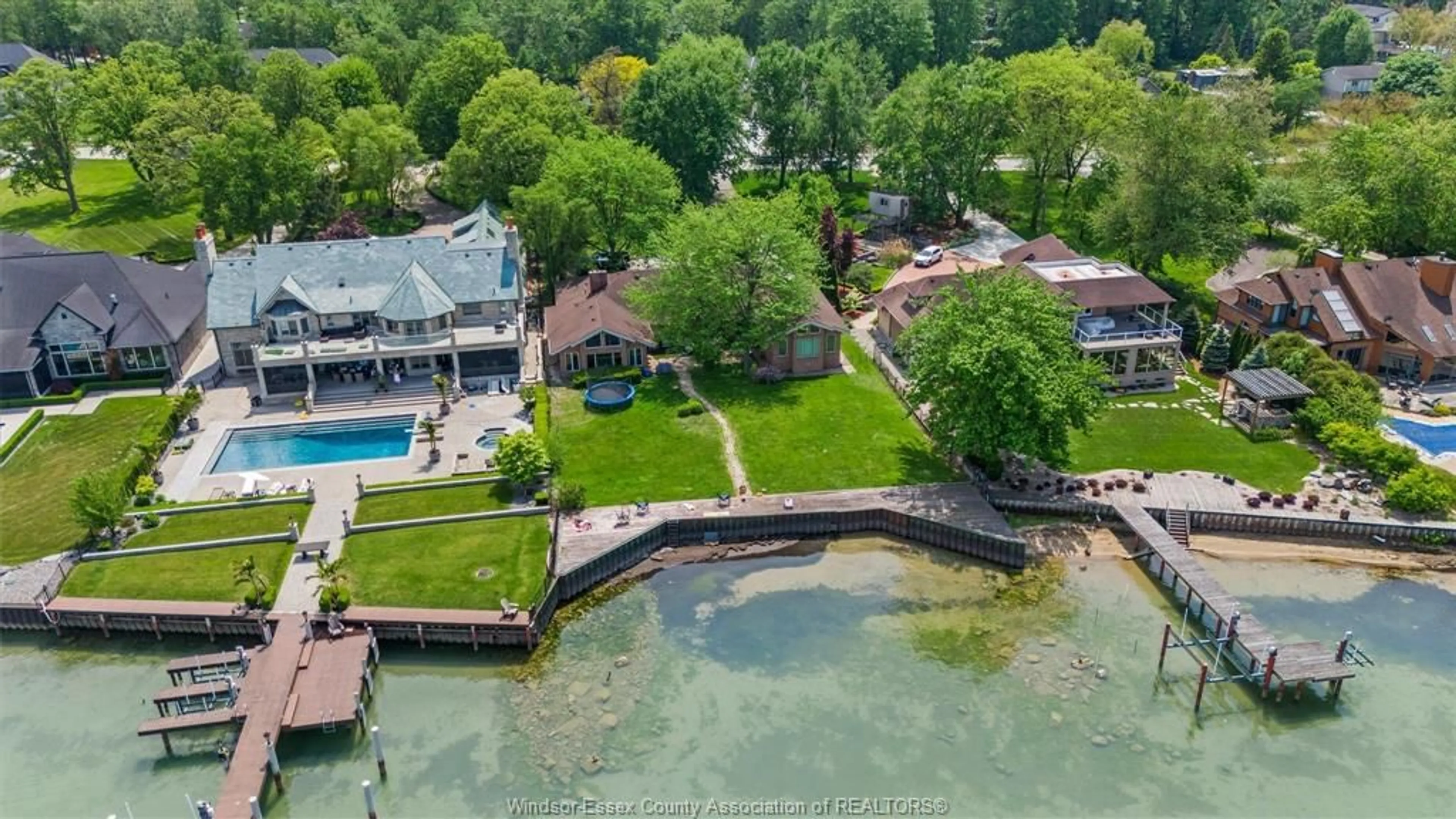 A pic from outside/outdoor area/front of a property/back of a property/a pic from drone, water/lake/river/ocean view for 410 RUSSELL WOODS Rd, Lakeshore Ontario N8N 3S5