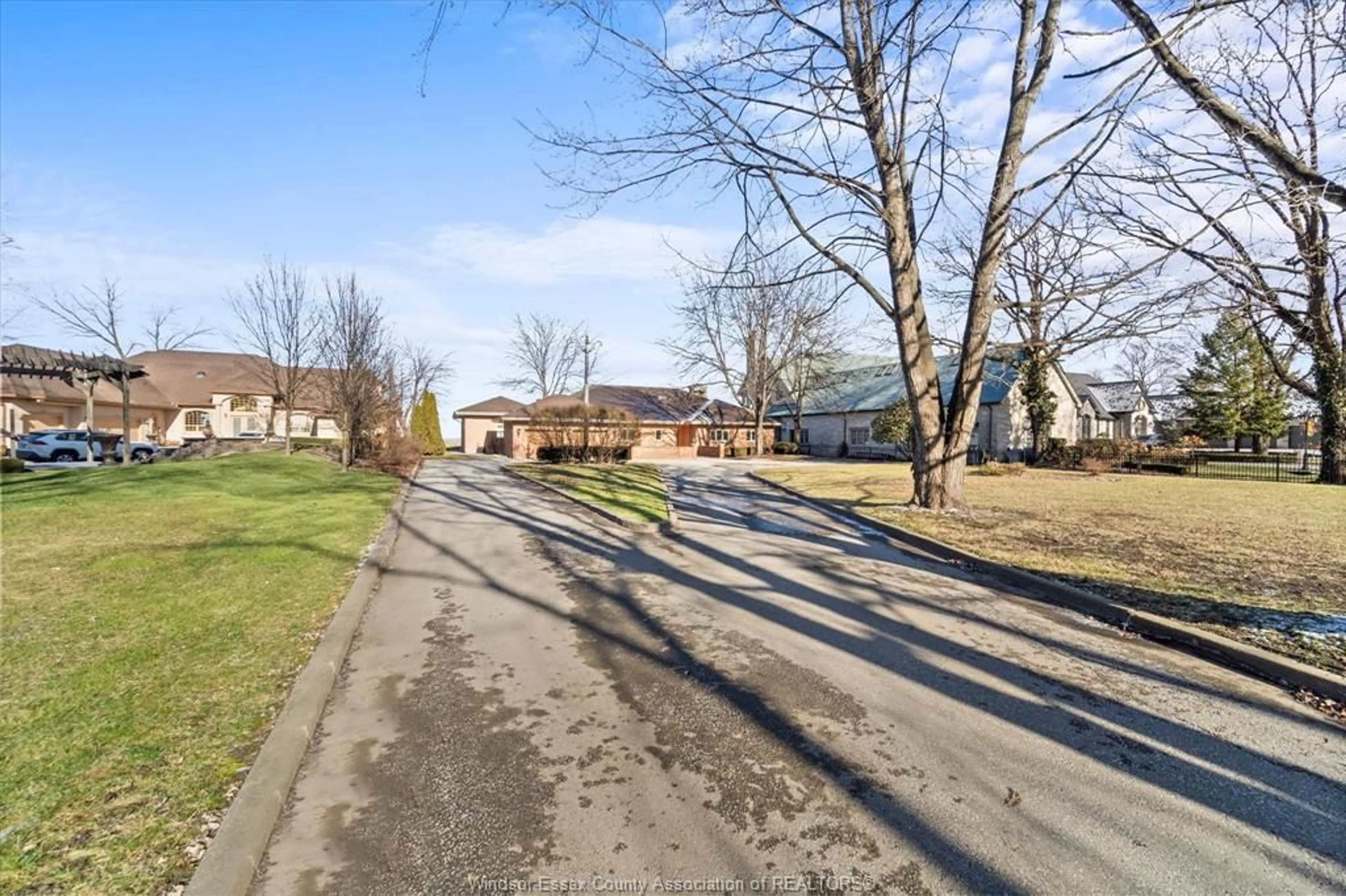 A pic from outside/outdoor area/front of a property/back of a property/a pic from drone, street for 410 RUSSELL WOODS Rd, Lakeshore Ontario N8N 3S5