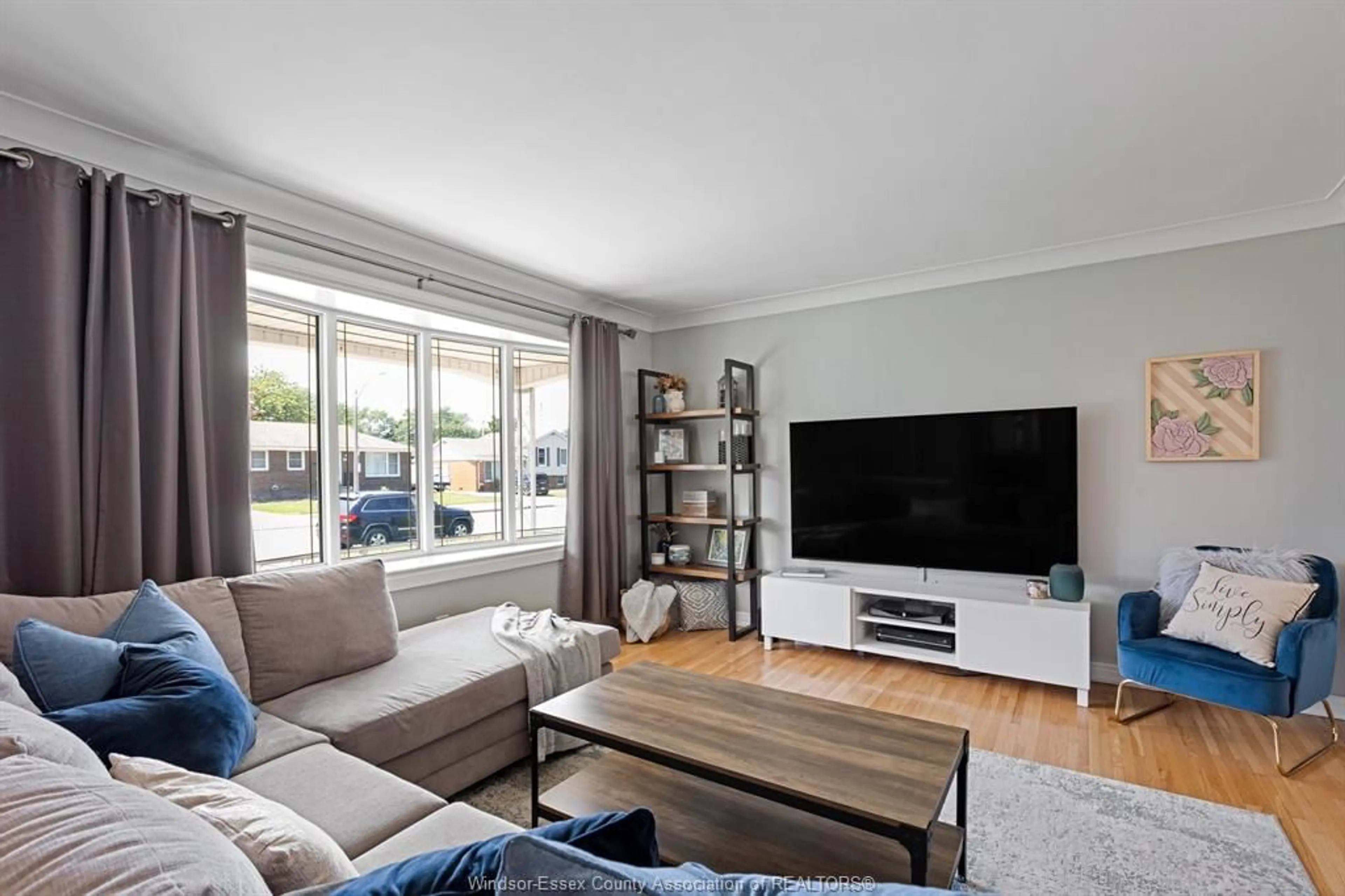 Living room with furniture, wood/laminate floor for 2584 RIVARD AVE, Windsor Ontario N8T 2H3