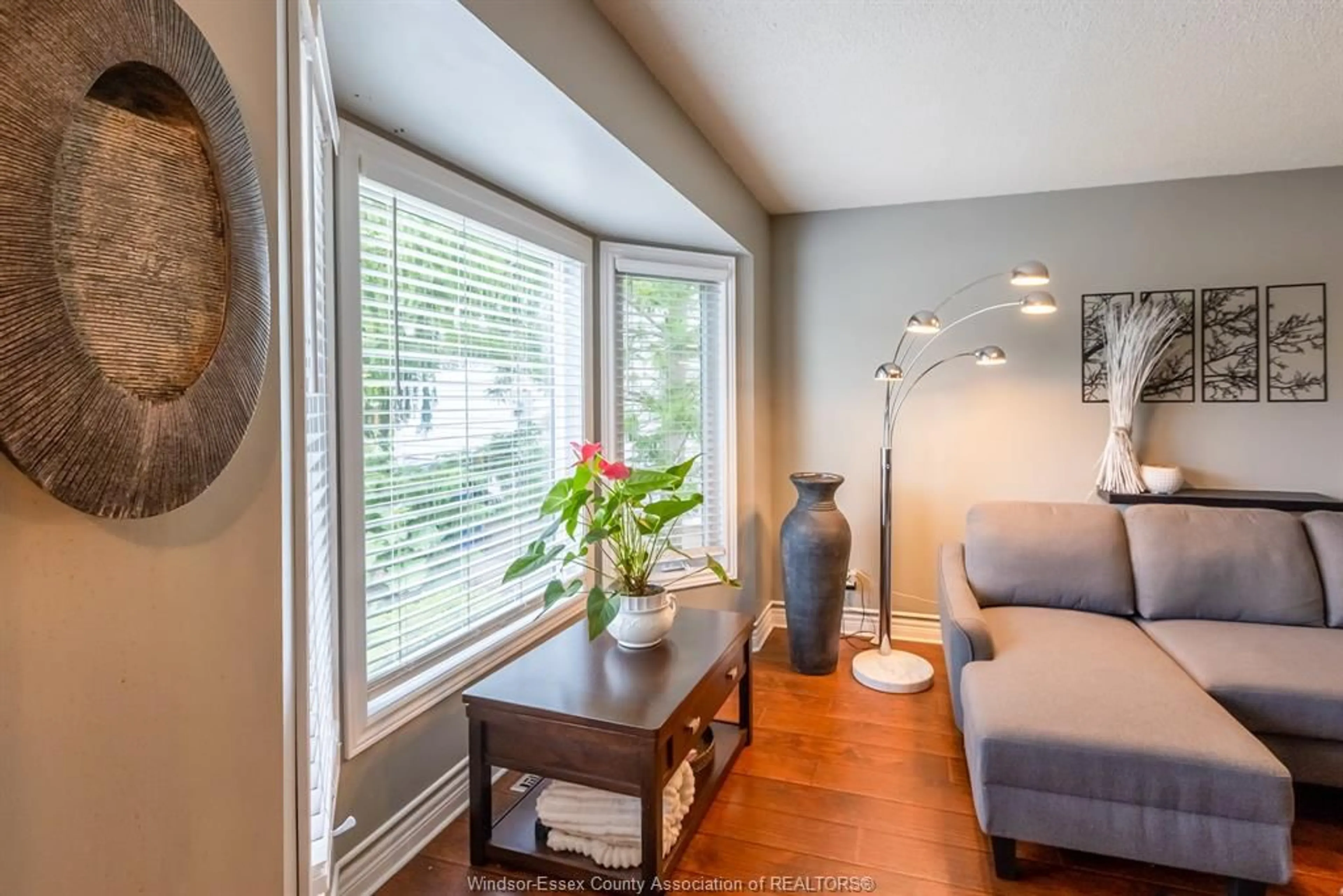 Living room with furniture, wood/laminate floor for 130 ROYAL Cres, Belle River Ontario N0R 1A0