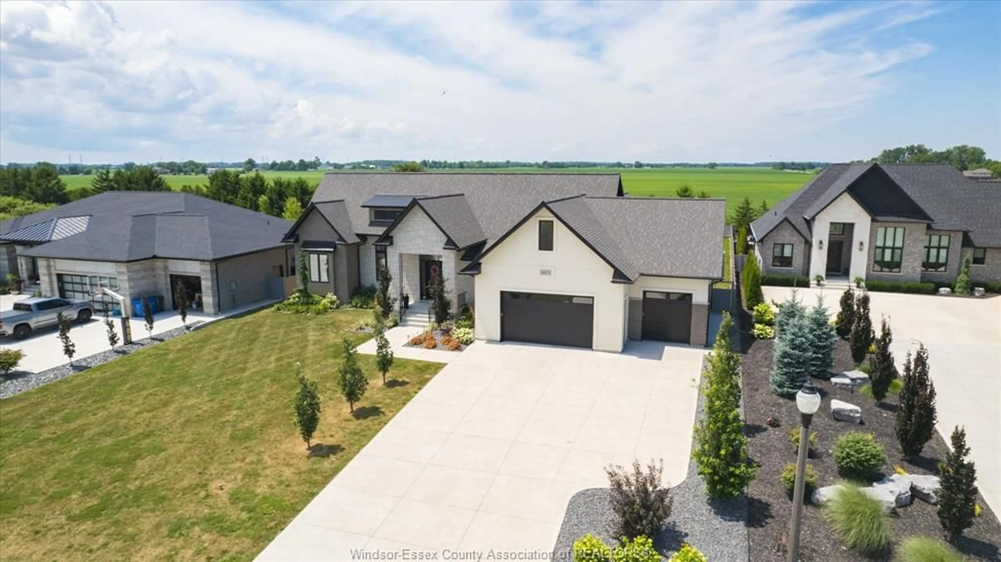 A pic from outside/outdoor area/front of a property/back of a property/a pic from drone, street for 1423 MULLINS Dr, Lakeshore Ontario N0R 1V0
