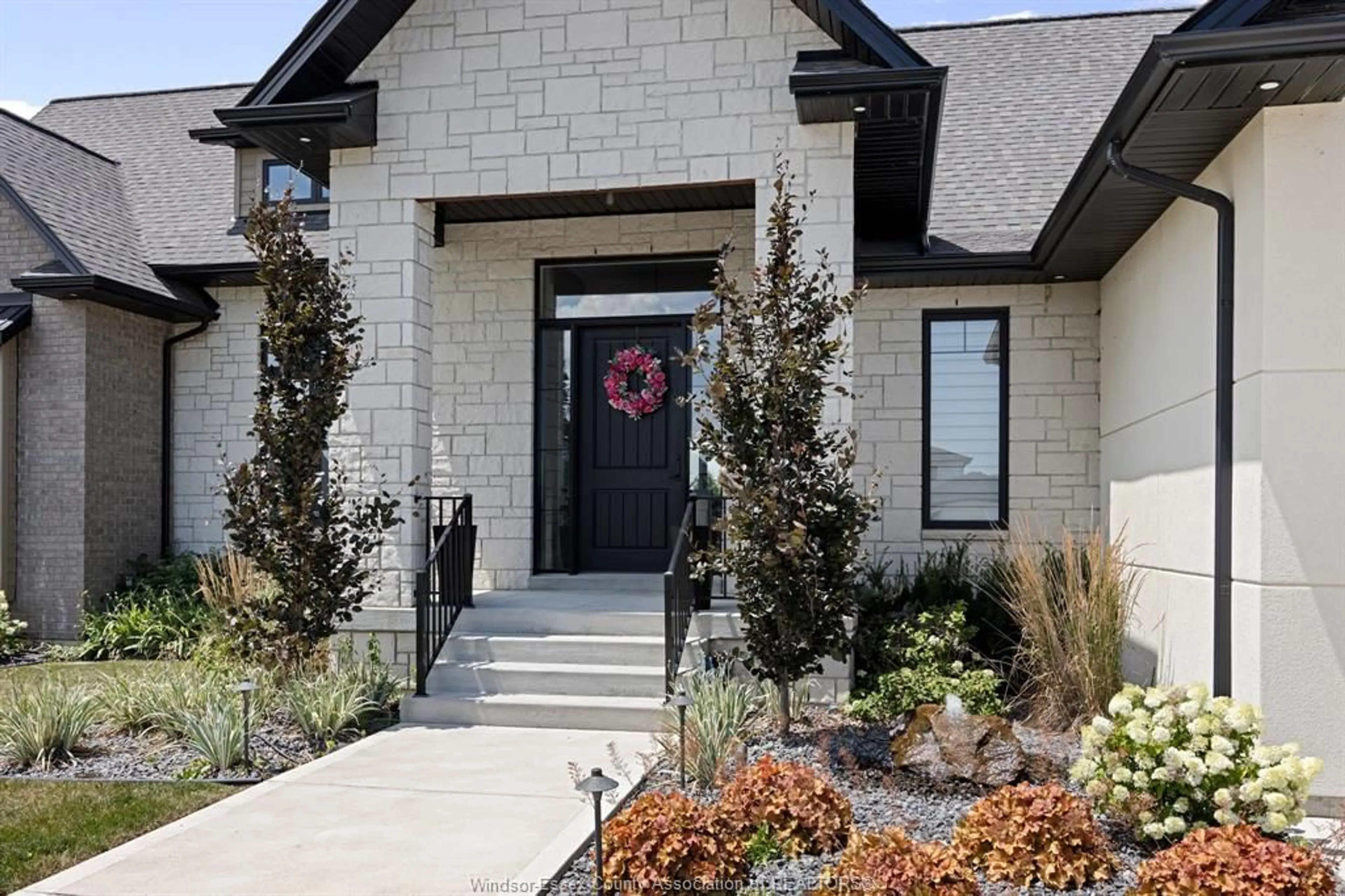 Home with brick exterior material, street for 1423 MULLINS Dr, Lakeshore Ontario N0R 1V0