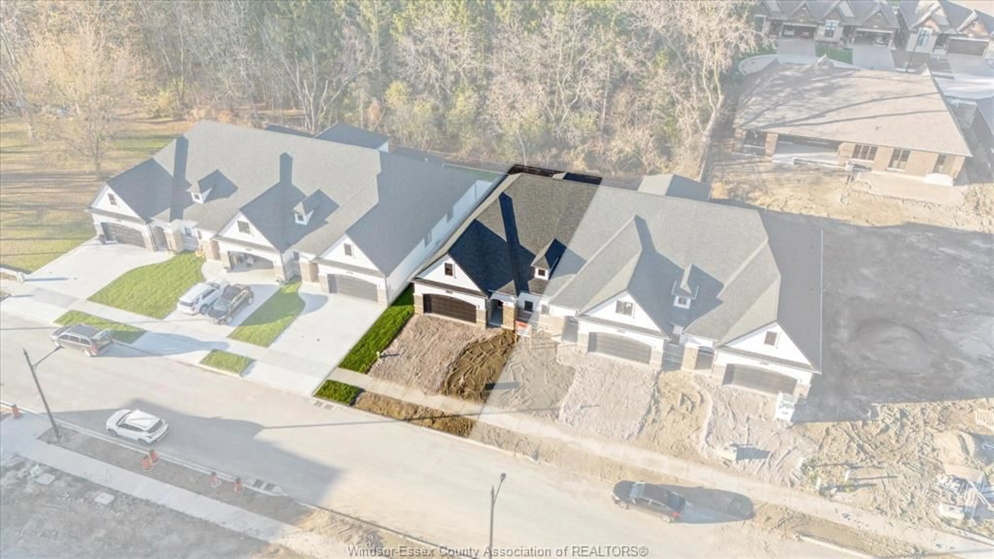 A pic from outside/outdoor area/front of a property/back of a property/a pic from drone, street for 3265 TULLIO Dr, LaSalle Ontario N9H 1H3