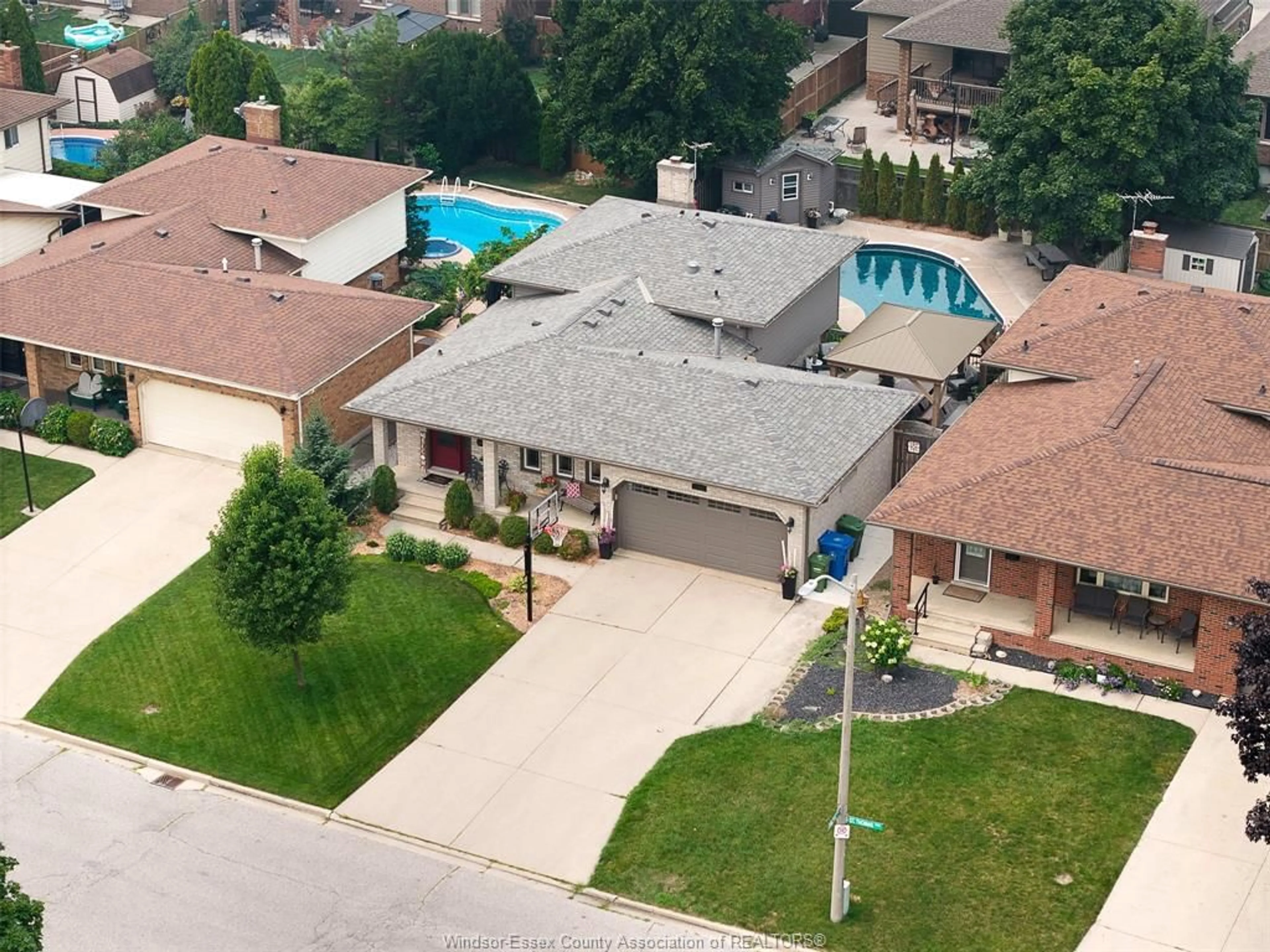 A pic from outside/outdoor area/front of a property/back of a property/a pic from drone, street for 12057 St. Thomas, Tecumseh Ontario N8N 3V6