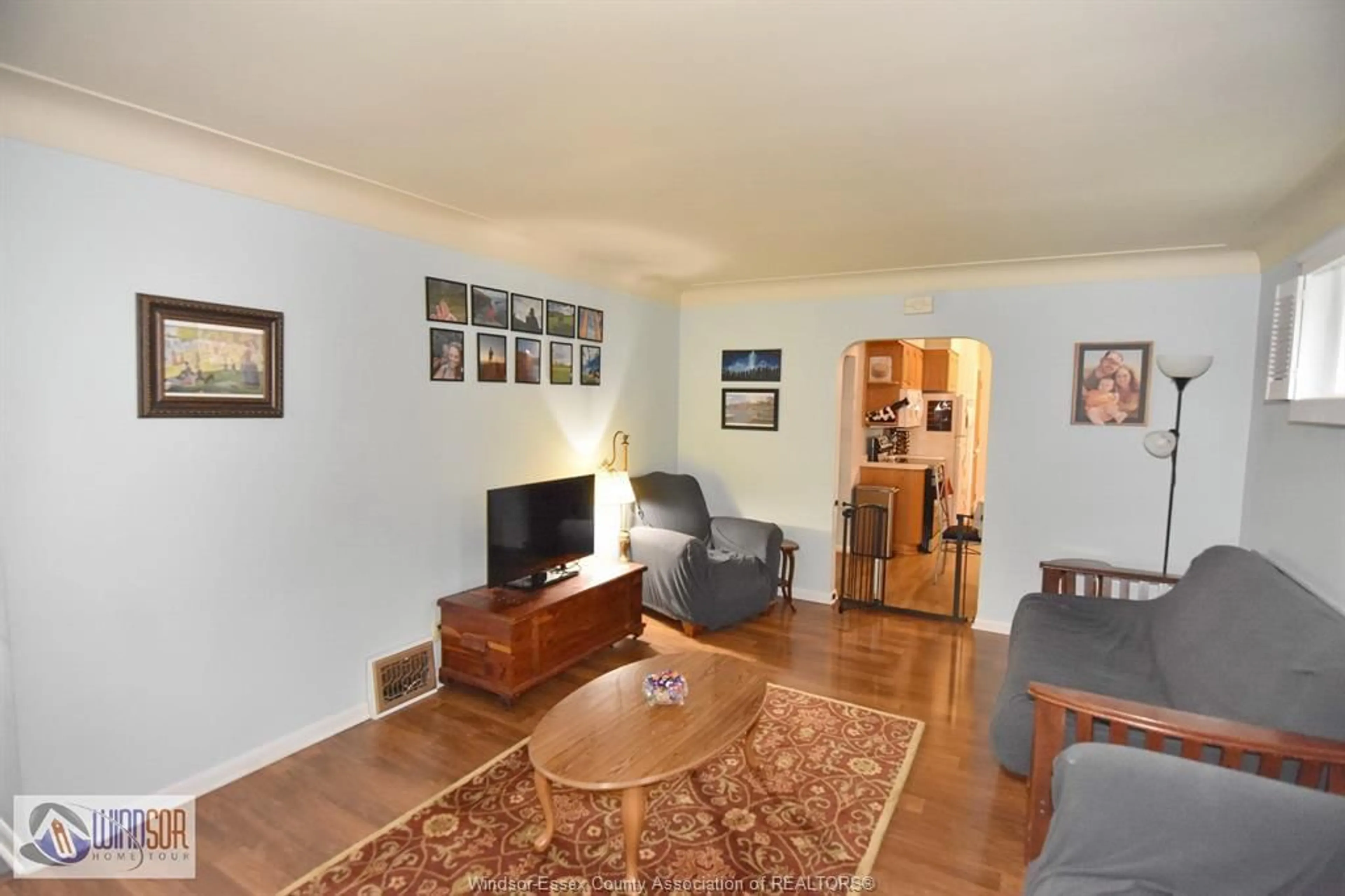Living room with furniture, wood/laminate floor for 1224 BELLE ISLE VIEW, Windsor Ontario N8S 3G7