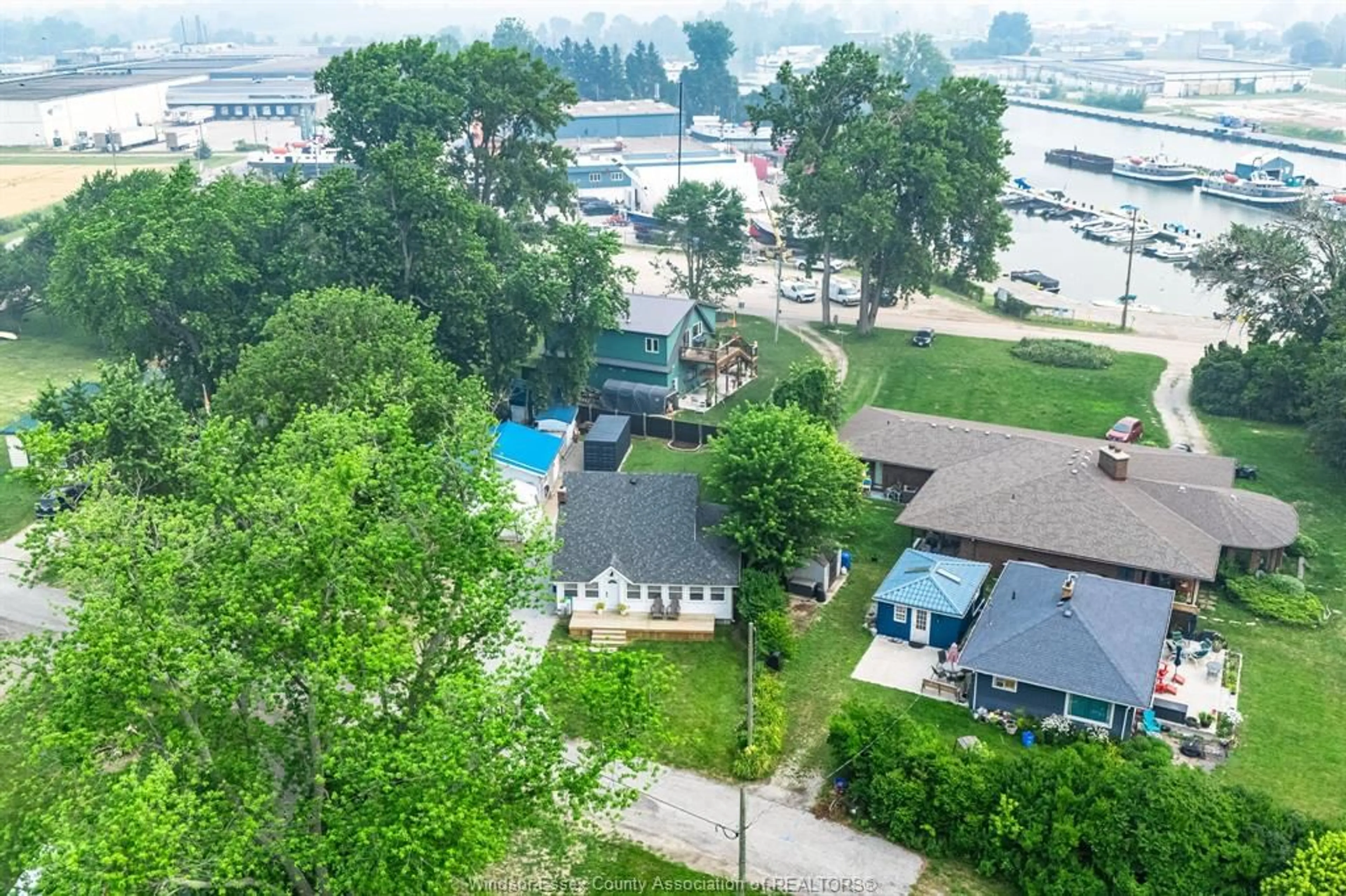 A pic from outside/outdoor area/front of a property/back of a property/a pic from drone, water/lake/river/ocean view for 13 Beach Blvd, Leamington Ontario N0P 2P0