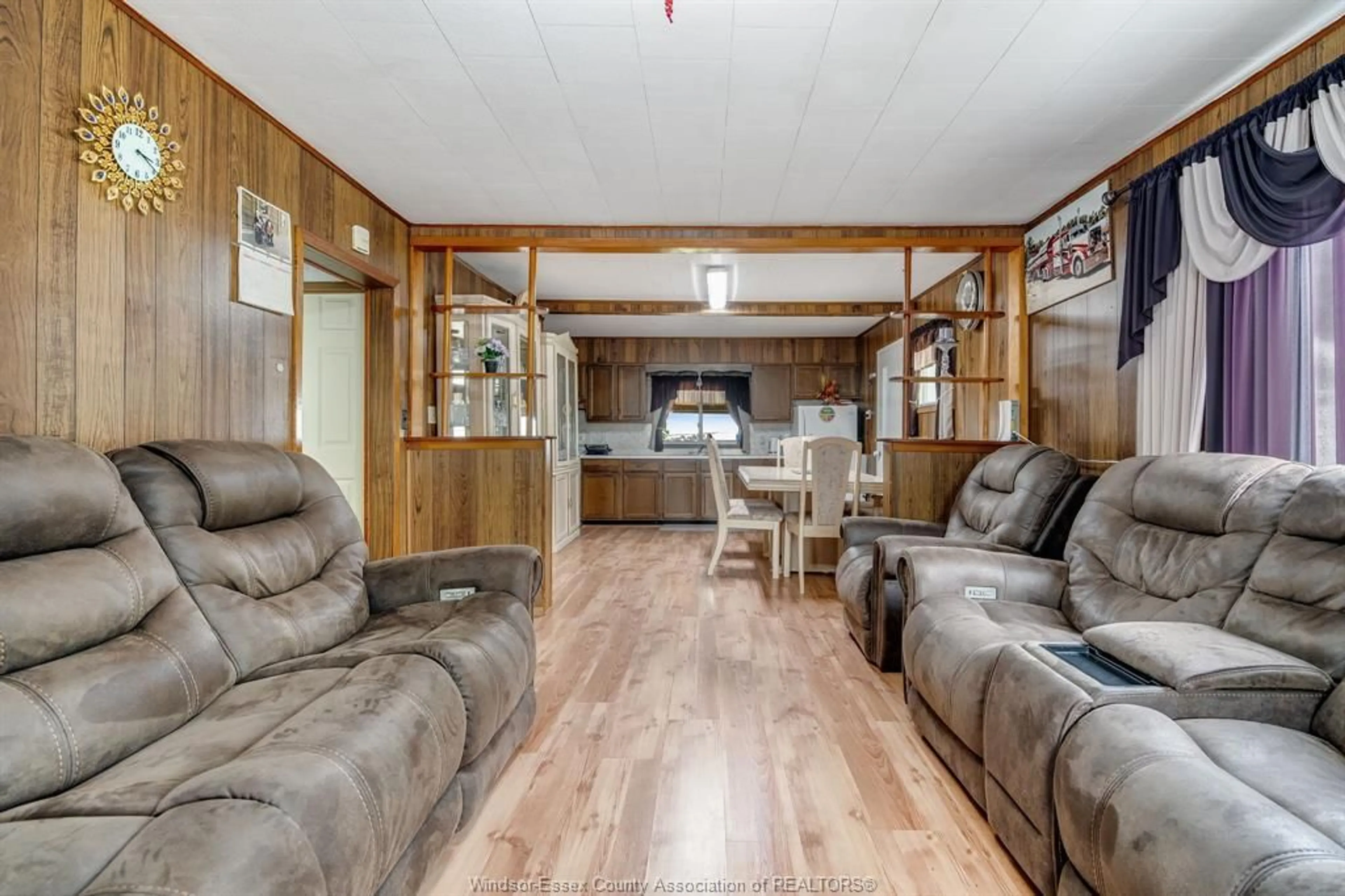 Living room with furniture, wood/laminate floor for 3070 County Rd 8, Lakeshore Ontario N0P 2J0