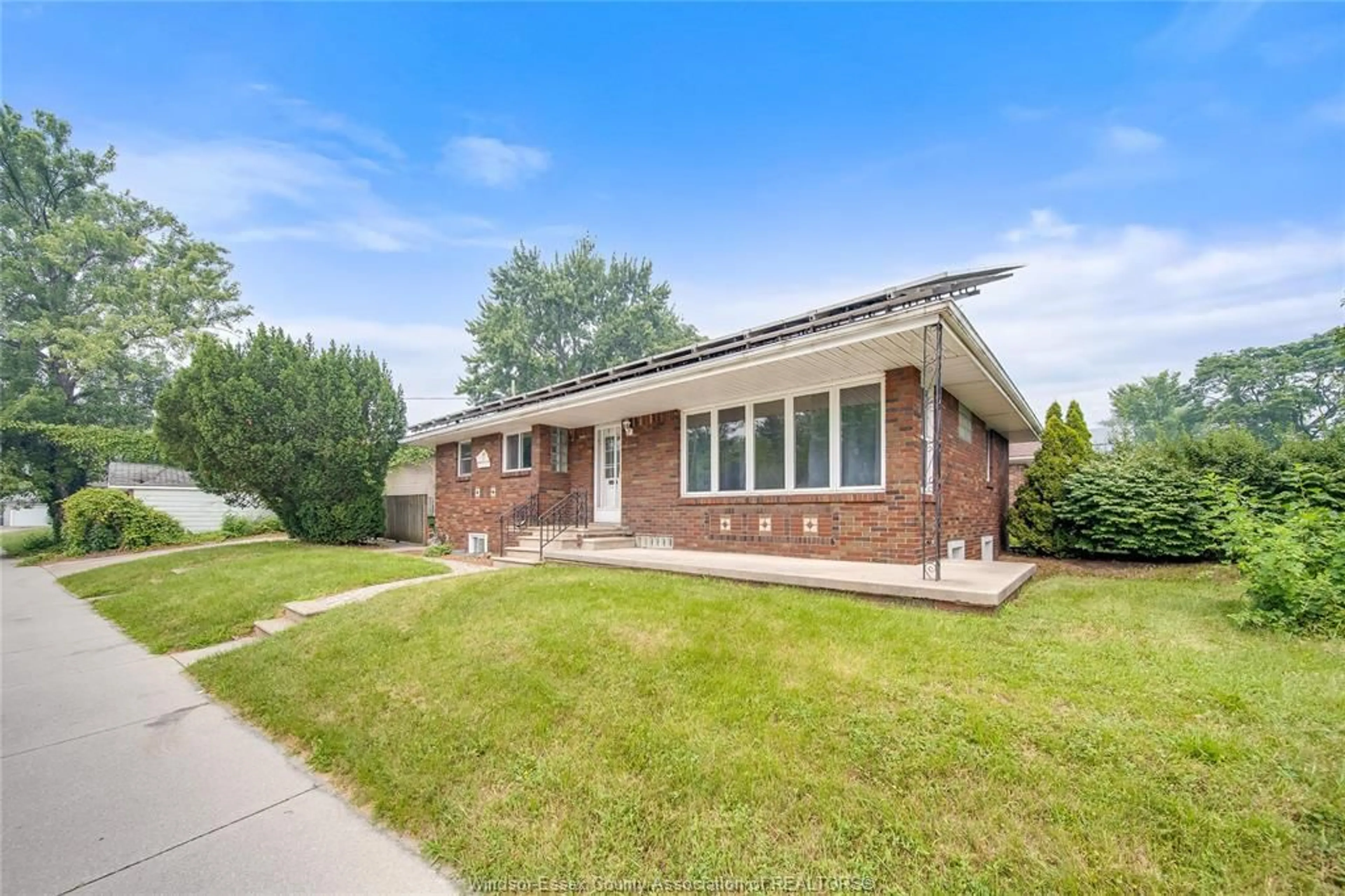 Home with brick exterior material, street for 2914 WYANDOTTE St, Windsor Ontario N9C 1M4