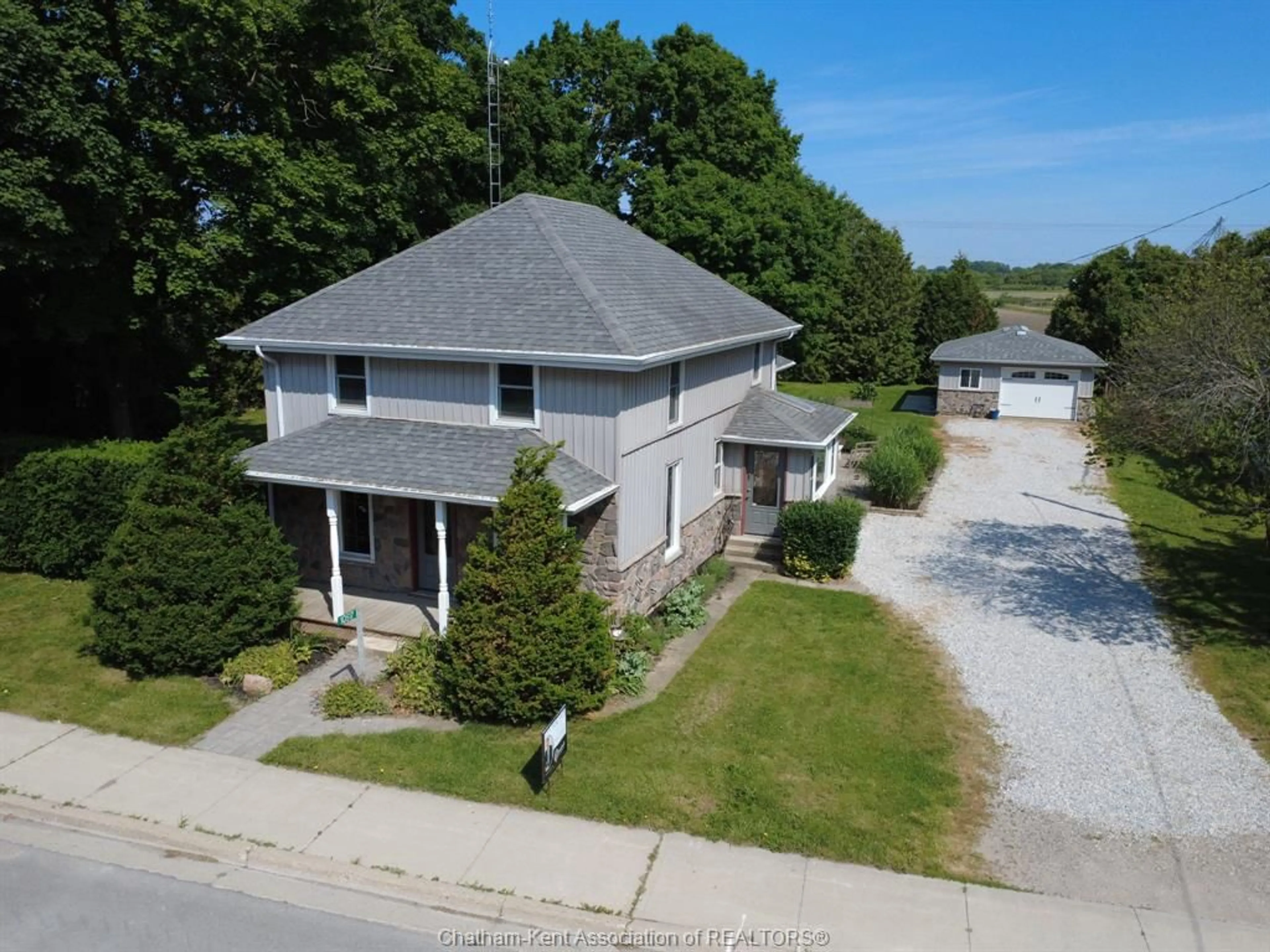 A pic from outside/outdoor area/front of a property/back of a property/a pic from drone, street for 10517 Longwoods Rd, Chatham Township Ontario N7M 5J7