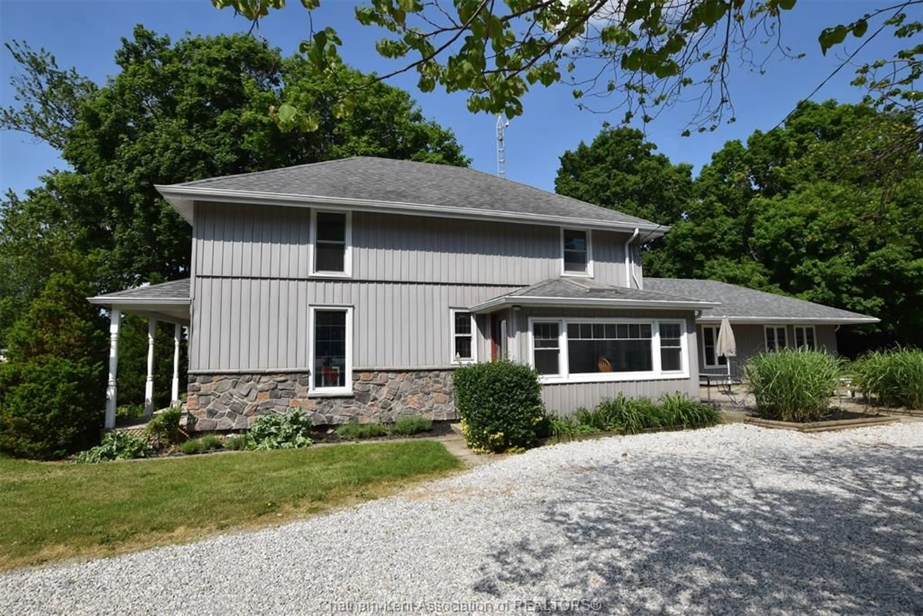 Home with vinyl exterior material, street for 10517 Longwoods Rd, Chatham Township Ontario N7M 5J7