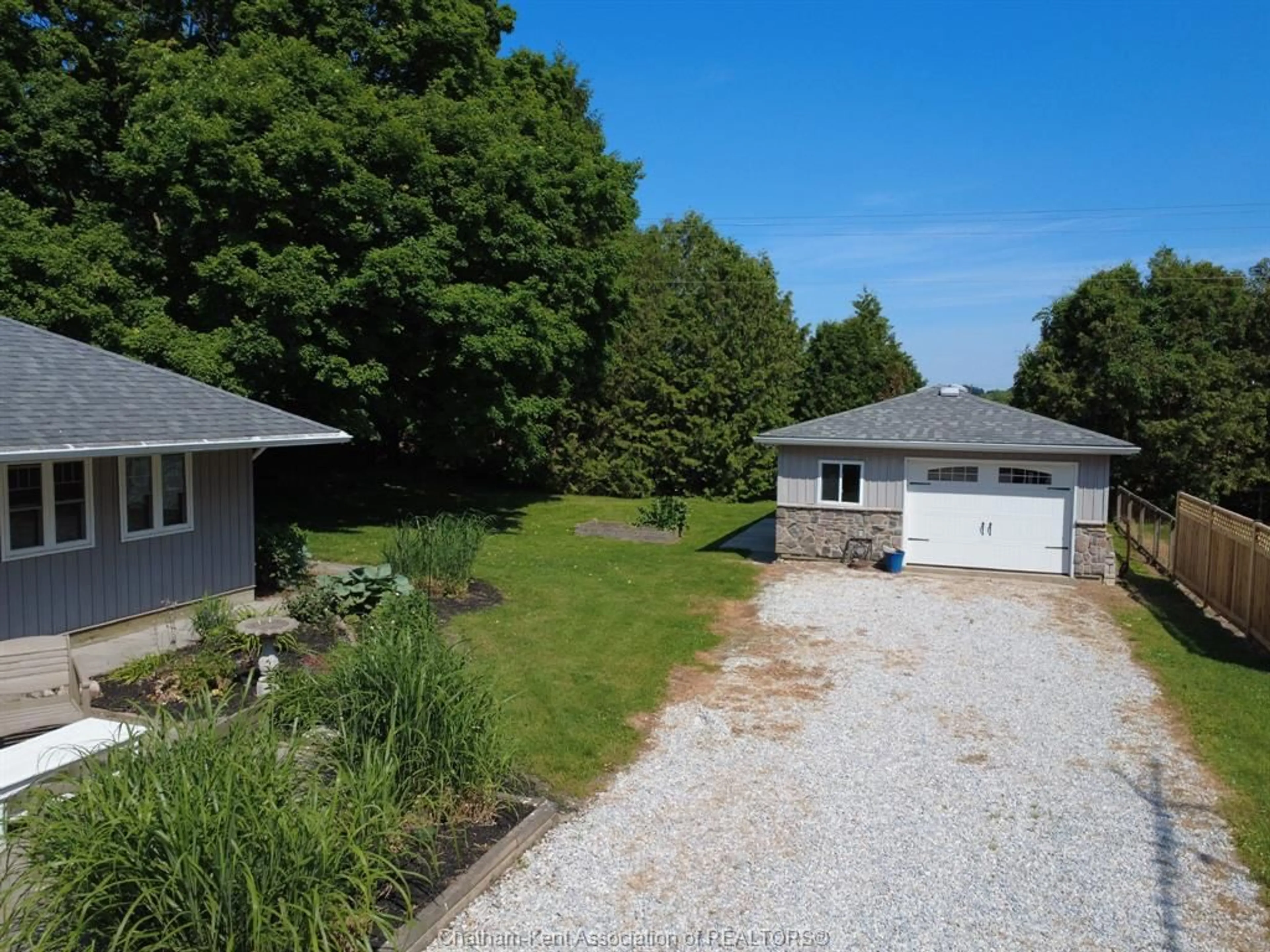 A pic from outside/outdoor area/front of a property/back of a property/a pic from drone, street for 10517 Longwoods Rd, Chatham Township Ontario N7M 5J7