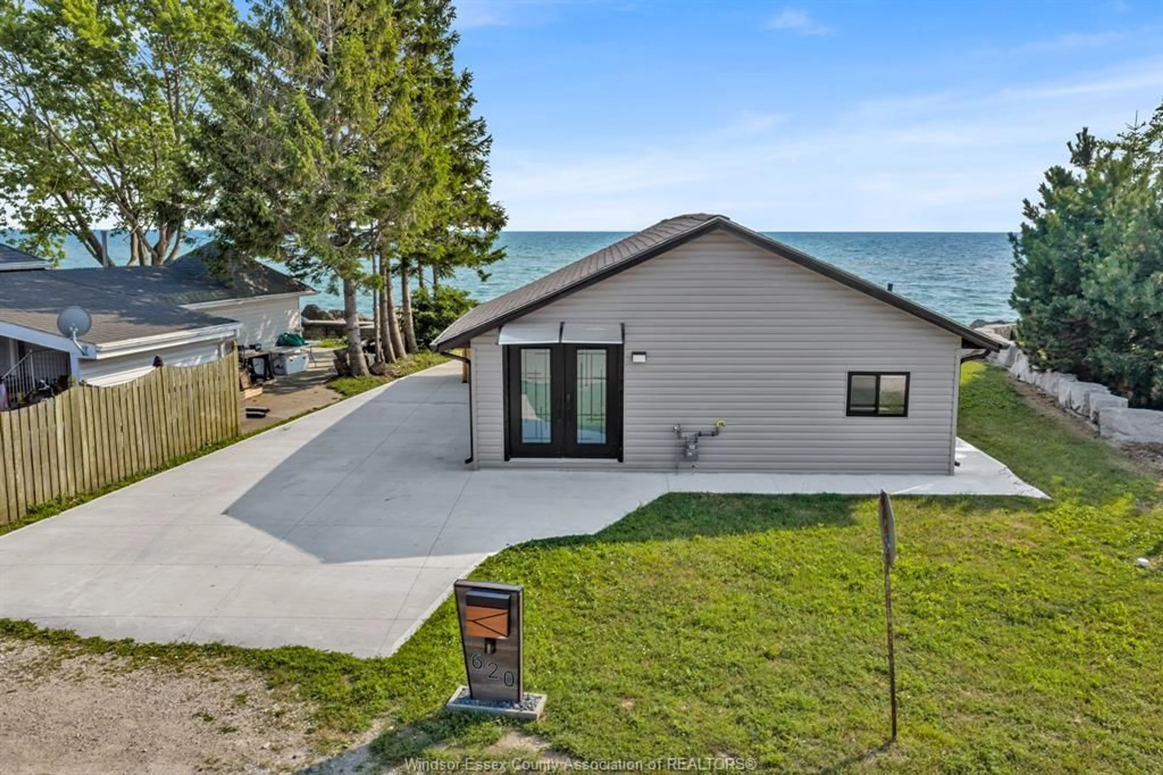 A pic from outside/outdoor area/front of a property/back of a property/a pic from drone, water/lake/river/ocean view for 620 POINT PELEE Dr, Leamington Ontario N8H 3V4